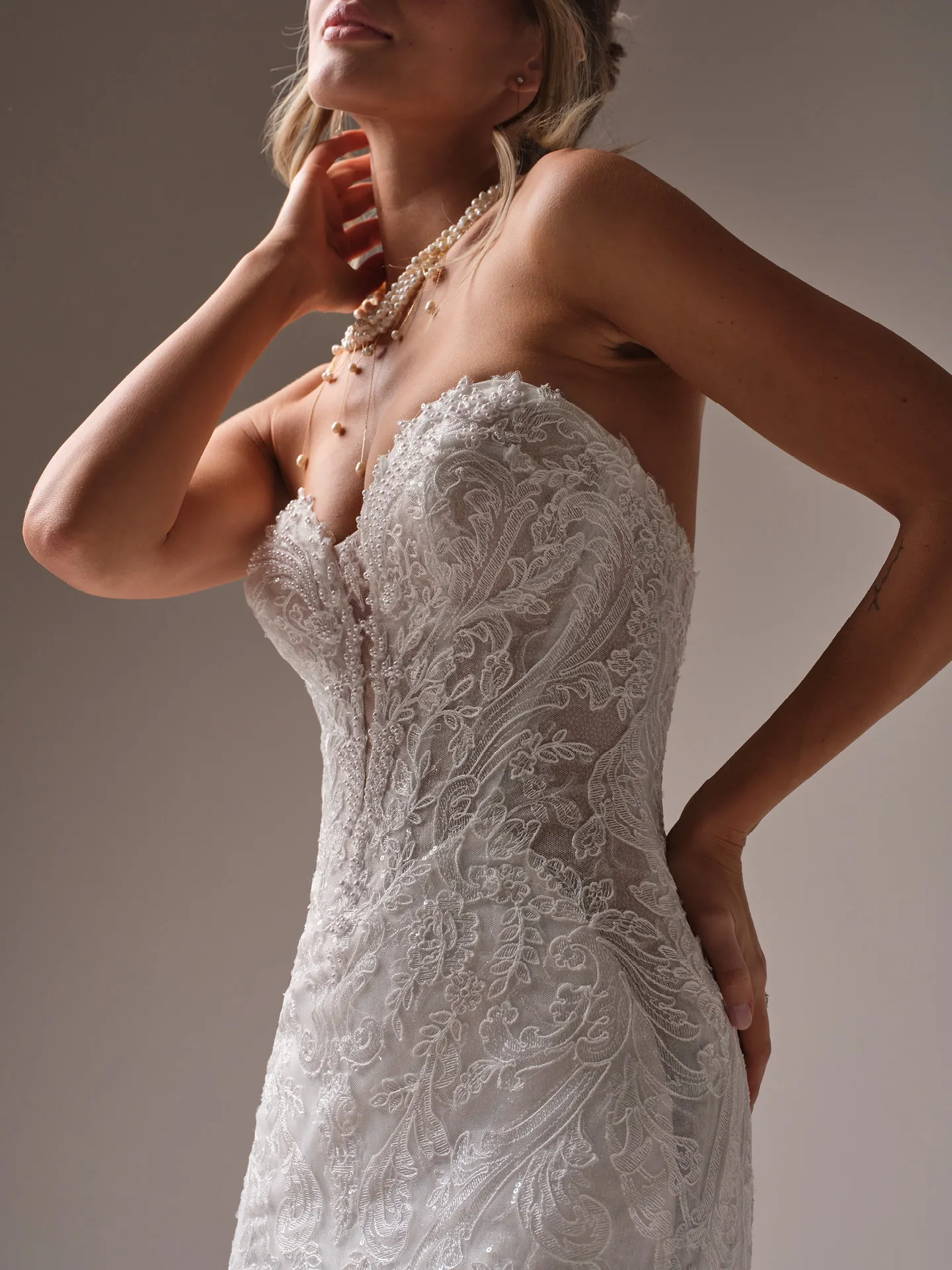 Zareen lace scalloped mermaid bridal dress by Sottero and Midgley, close-up side view