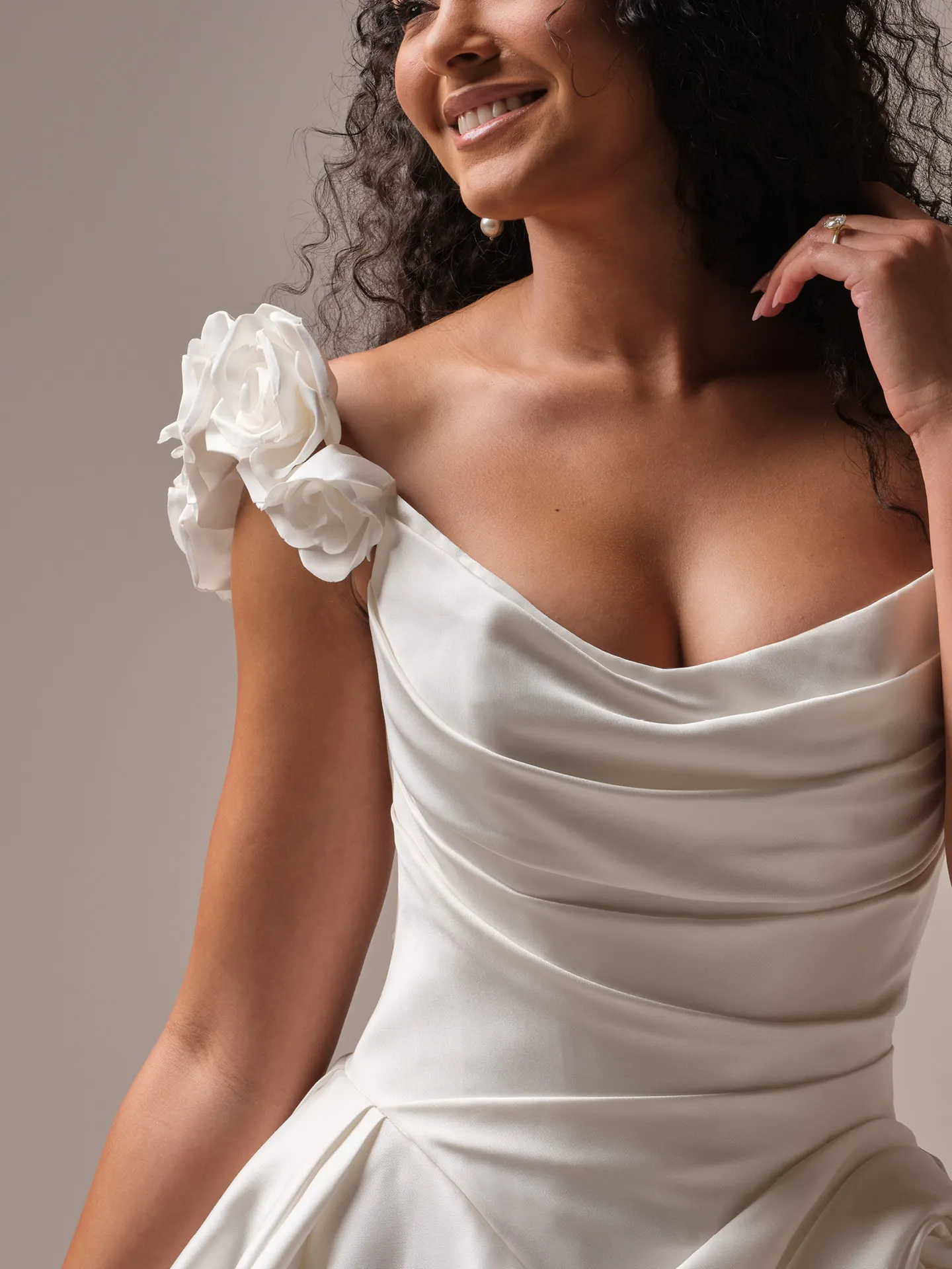 Maggie Sottero wedding dress with -D flower strap, satin fabric, close-up front view