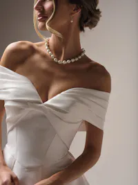 Stately off-the-shoulder Felicity Mikado pleated cap-sleeves