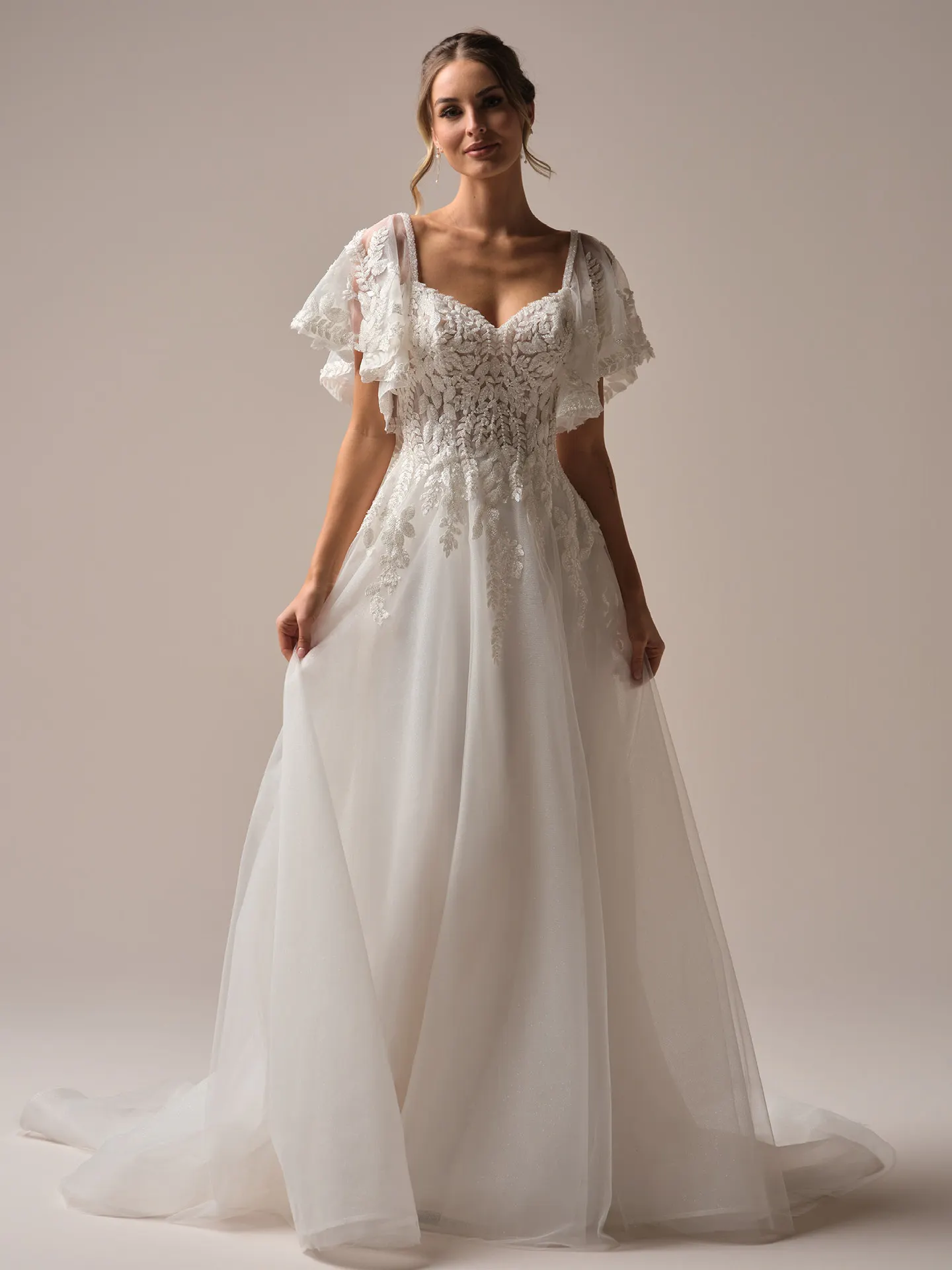 Rebecca Ingram Carmen front view with flutter sleeves and beaded lace.