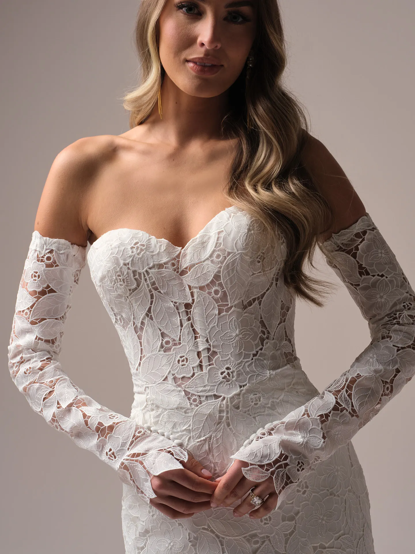 Maggie Sottero Dakota front view, lace long sleeves with covered button closure