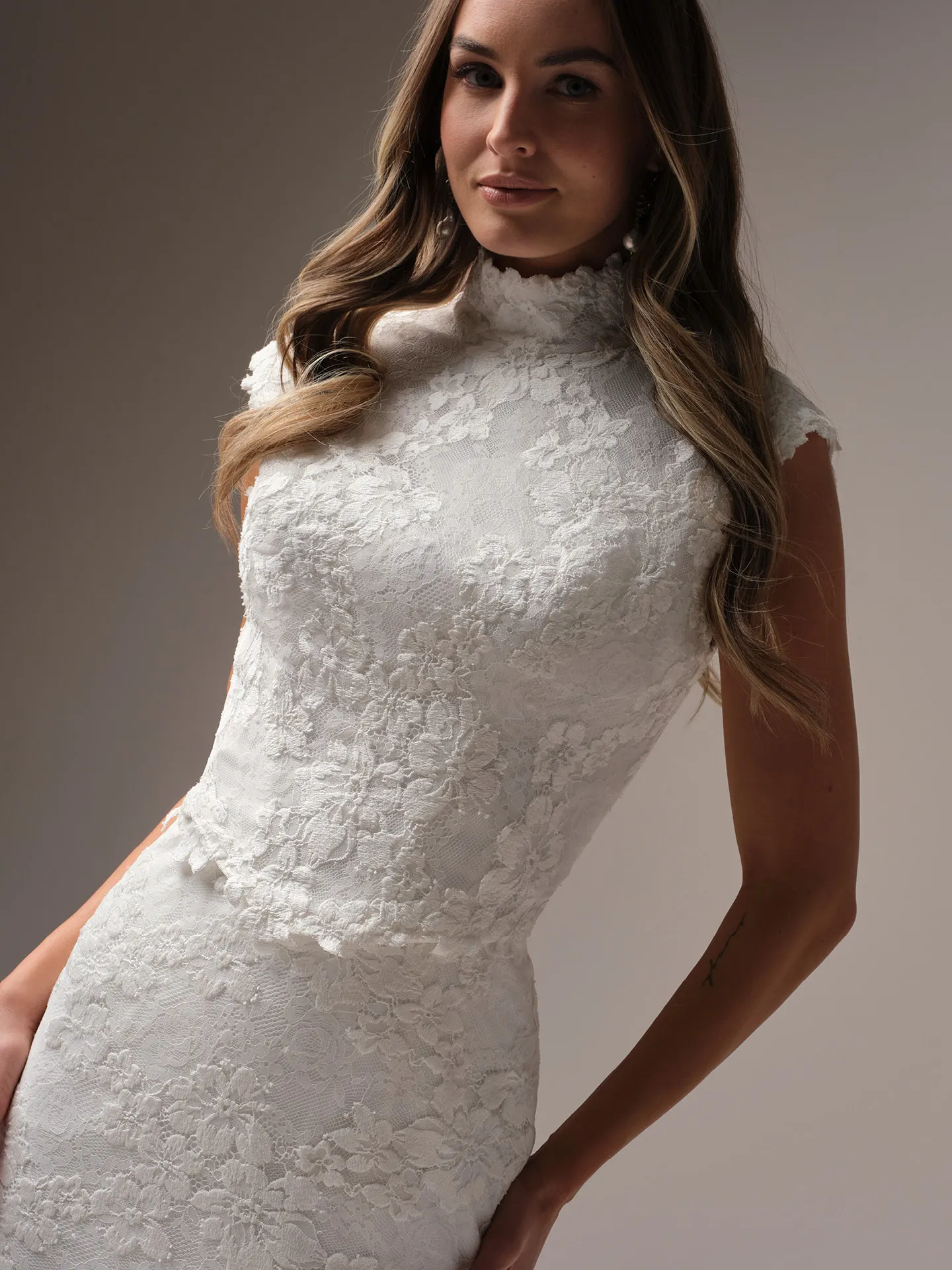 Maggie Sottero Devon Modest Jacket, lace with cap-sleeves, close-up front view