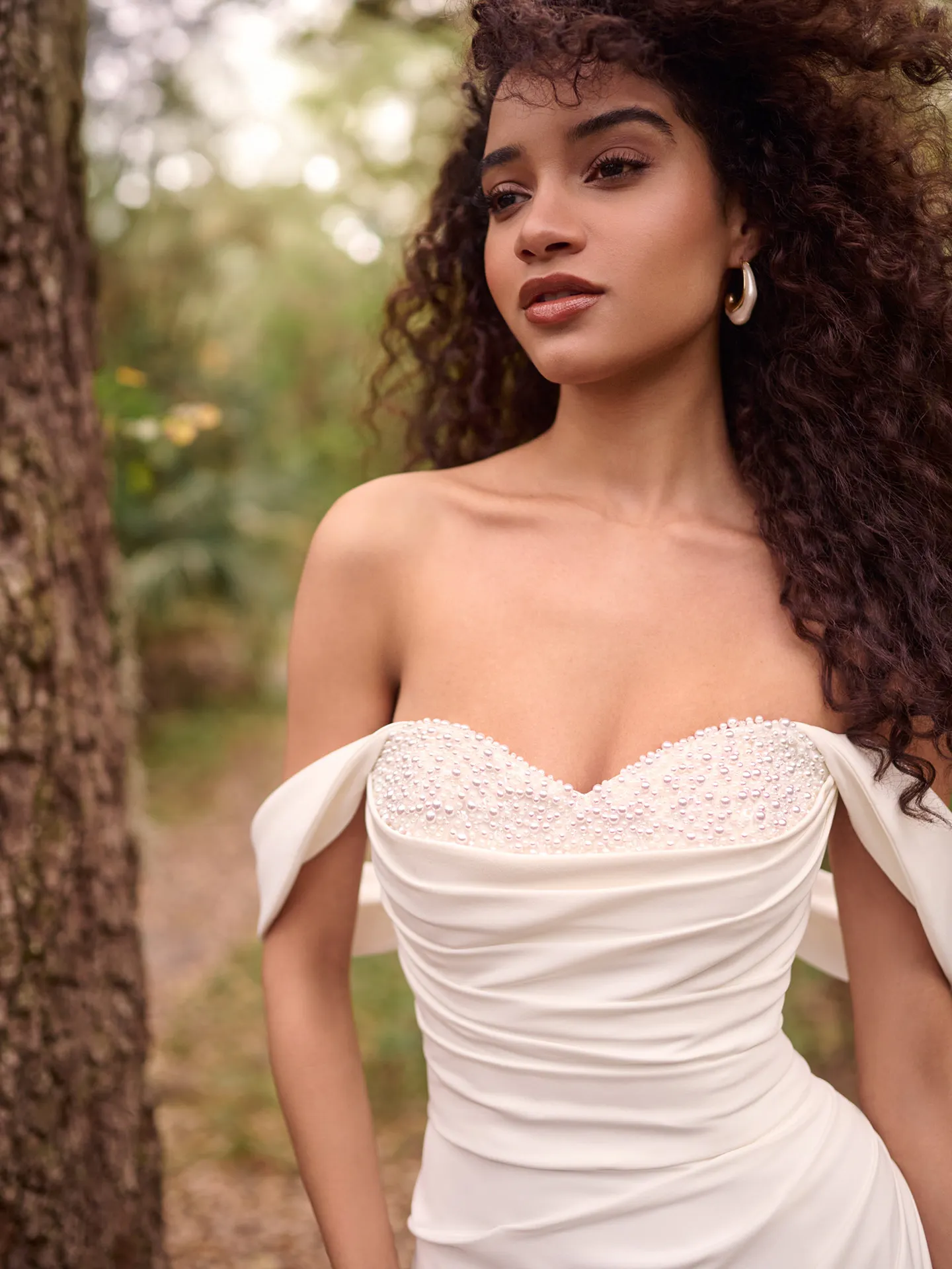 Rebecca Ingram Kathleen front view, off-shoulder, beaded bodice, outdoor setting