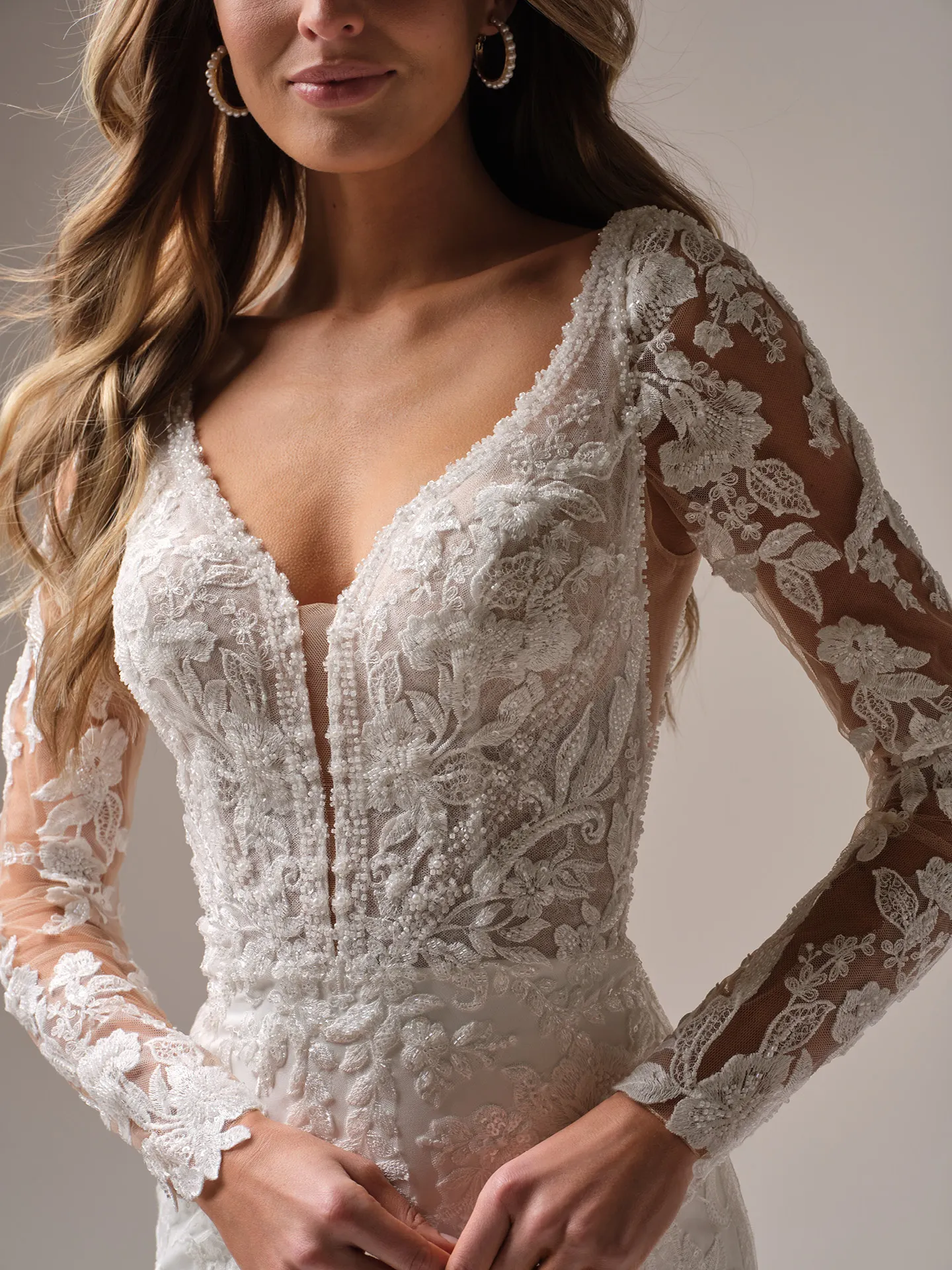 Rebecca Ingram Larissa front view: long fitted illusion beaded lace sleeves