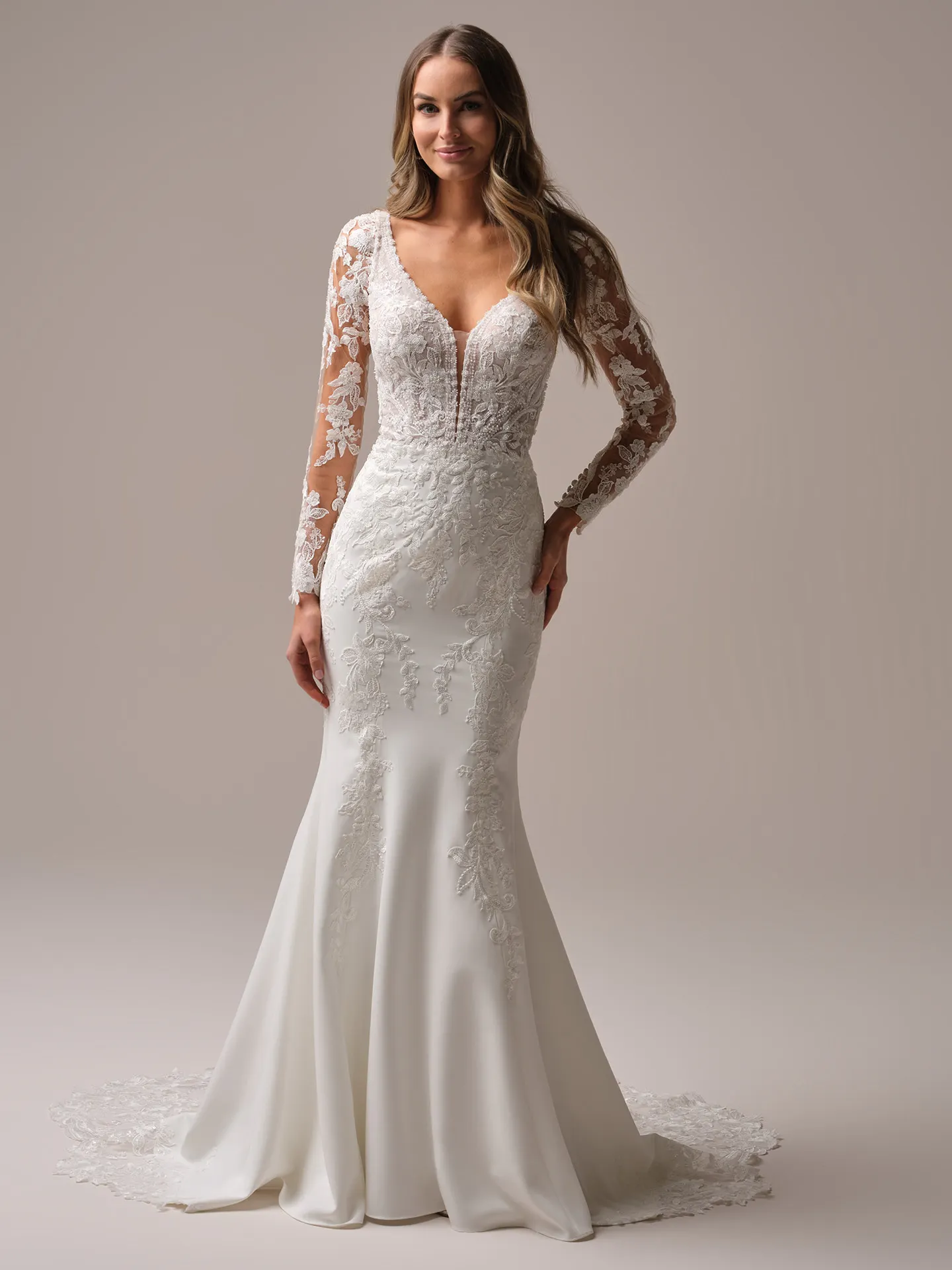 Rebecca Ingram Larissa front view; lace sleeves, fitted silhouette, V-neck.