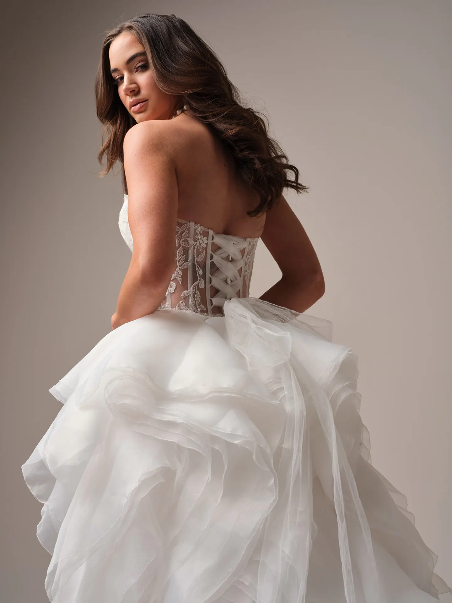 Maggie Sottero Meredith train detachable train side angle with flowing tulle