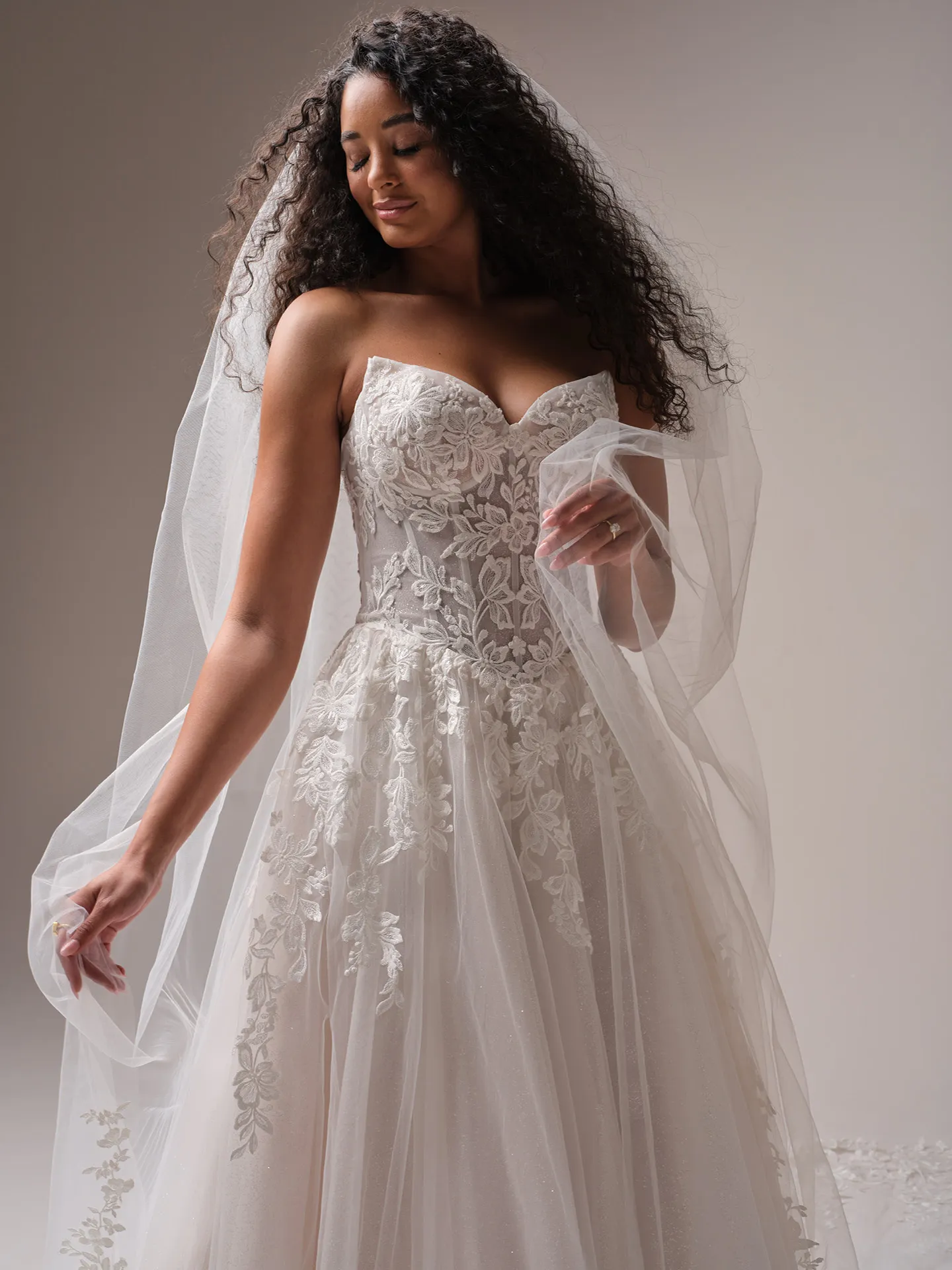 Rebecca Ingram lace strapless gown with scalloped royal length veil front view