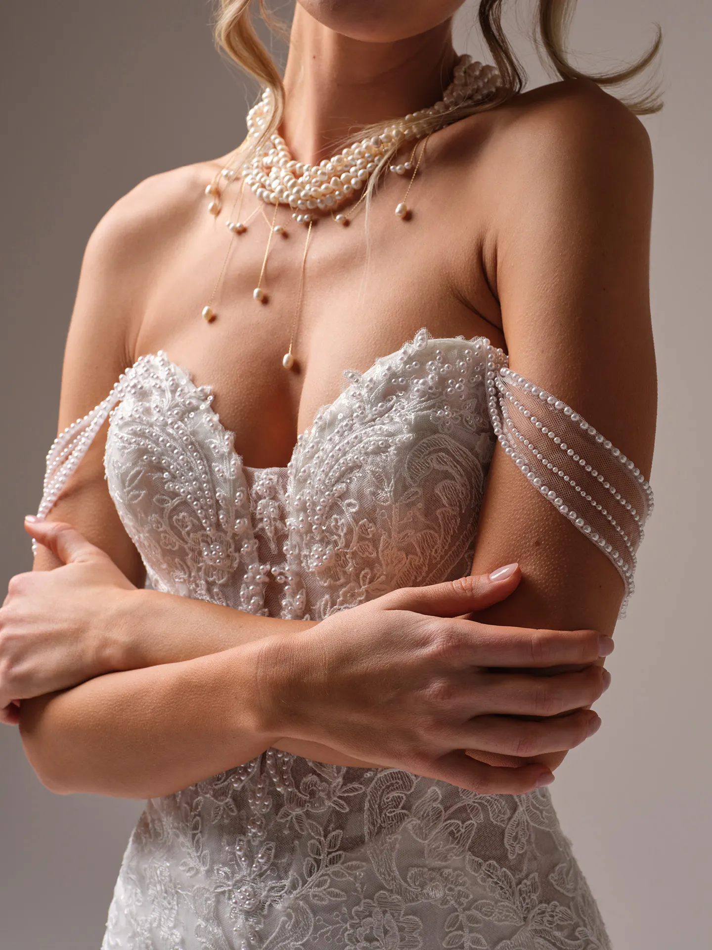 Sottero and Midgley Zareen off-the-shoulder lace dress with pearl cap-sleeves front view
