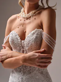 Dainty off-the-shoulder illusion draped pearl cap-sleeves