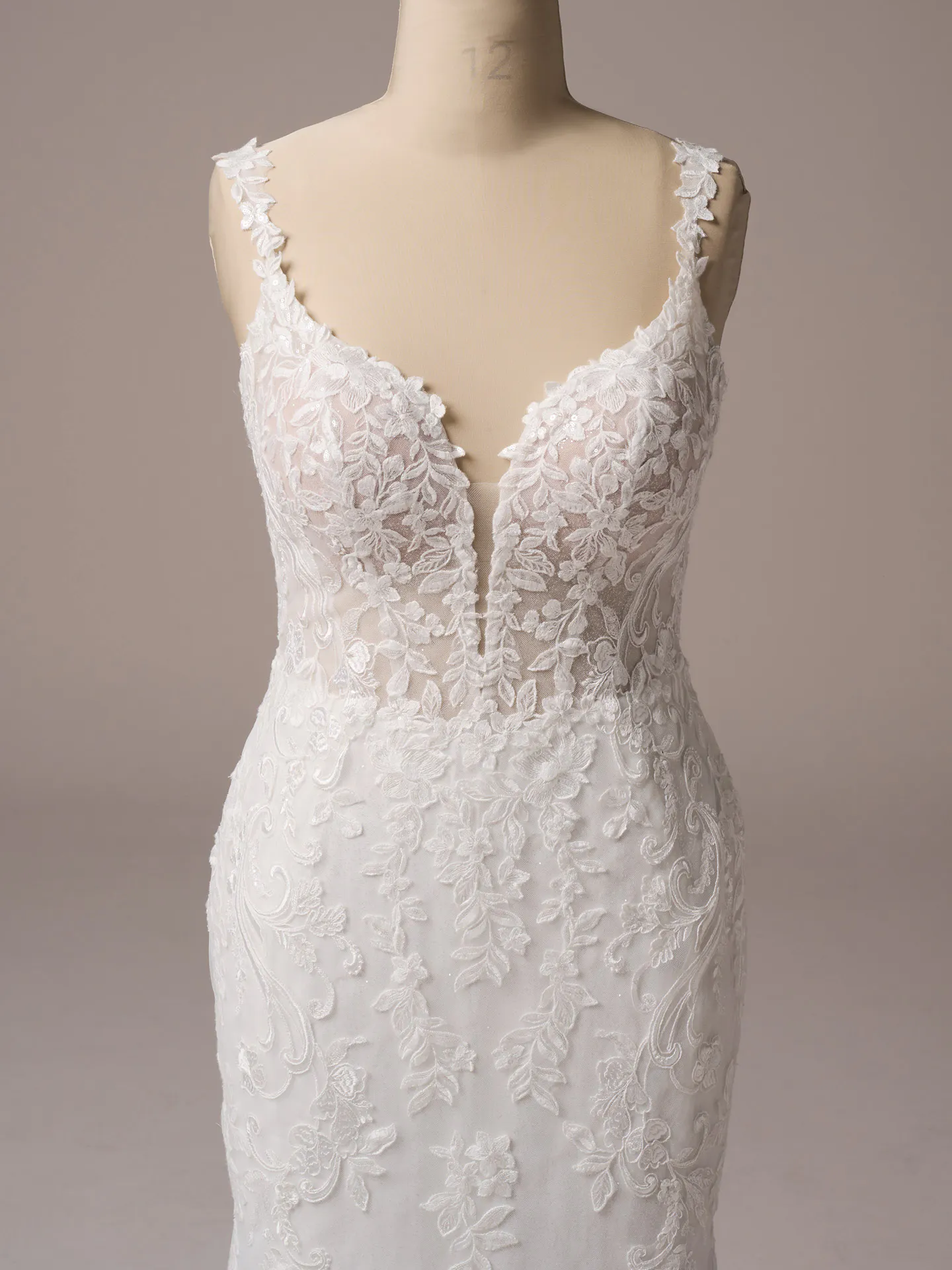 Rebecca Ingram Candice front view lace floral mermaid wedding dress mannequin display.