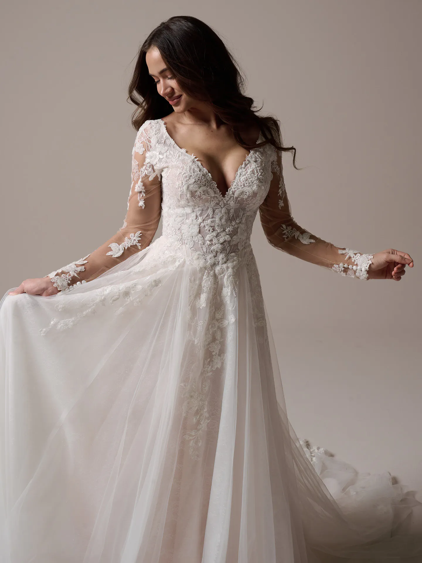 Rebecca Ingram Honor front view: beaded V-neck A-line bridal gown with lace sleeves.