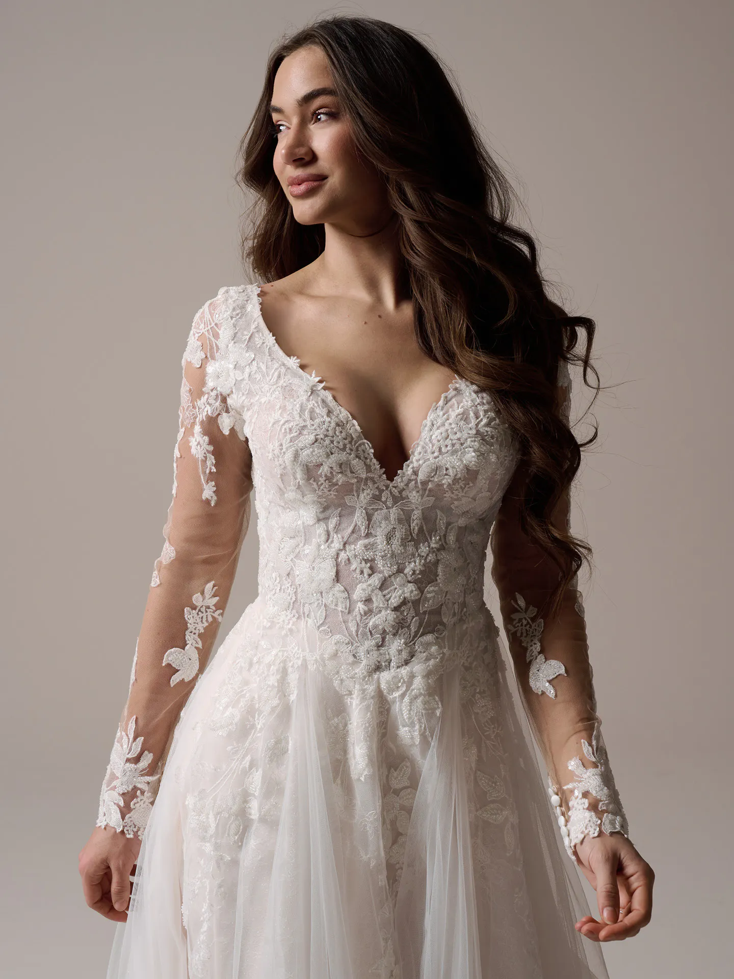 Rebecca Ingram Honor V-neck A-line gown front view with floral lace and sheer sleeves.