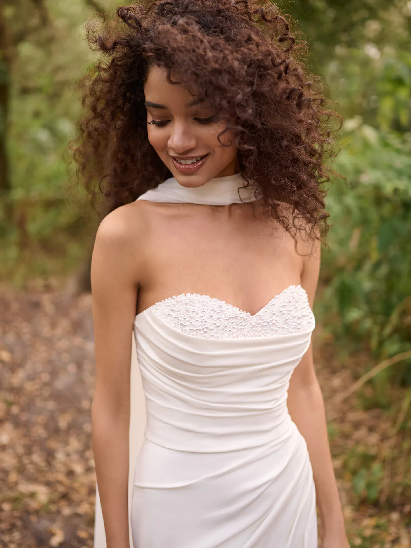 Rebecca Ingram Kathleen front view with detachable shoulder wrap in nature setting.