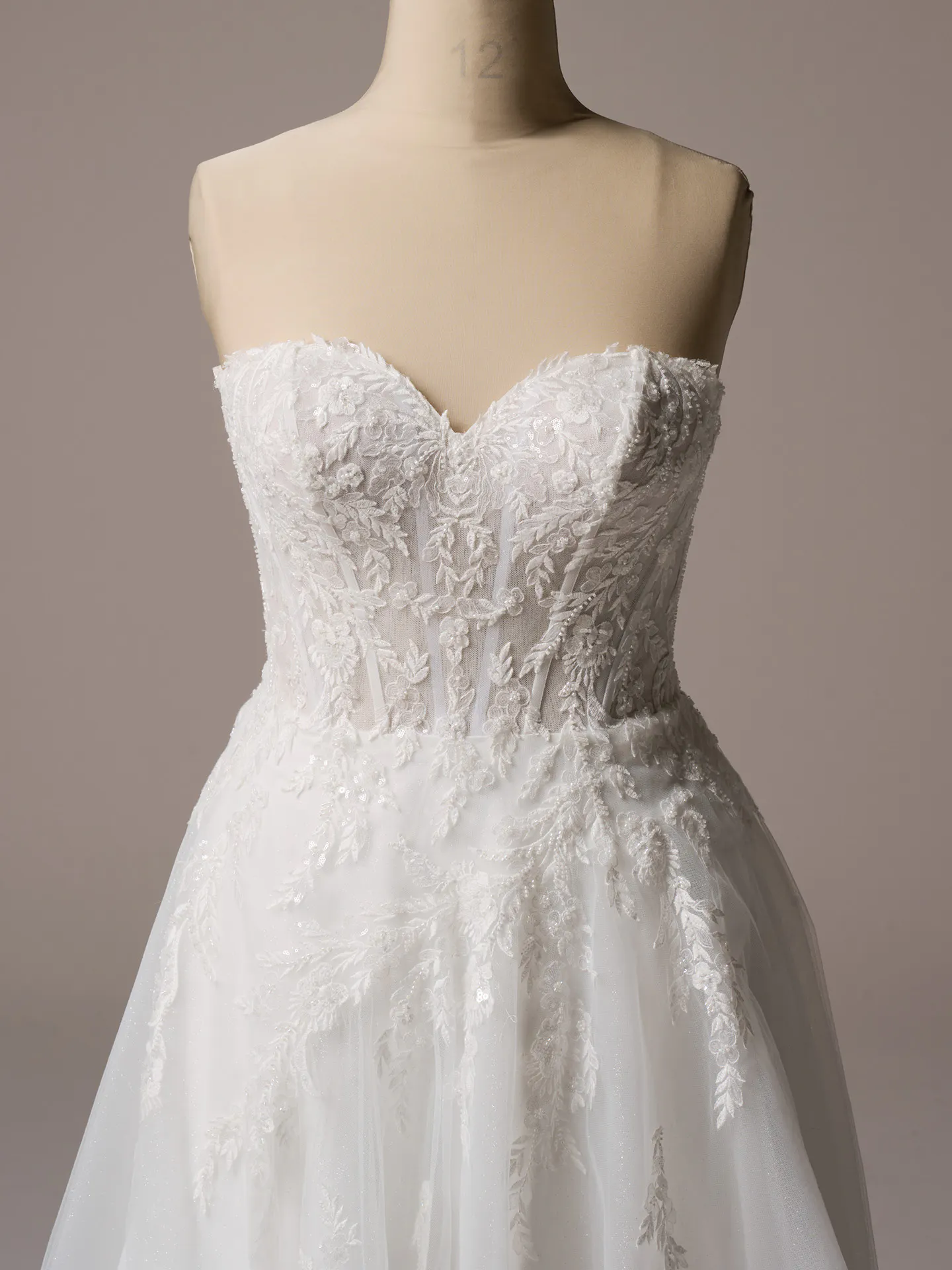 Rebecca Ingram Victoria front view floral A-line gown with sparkly details.