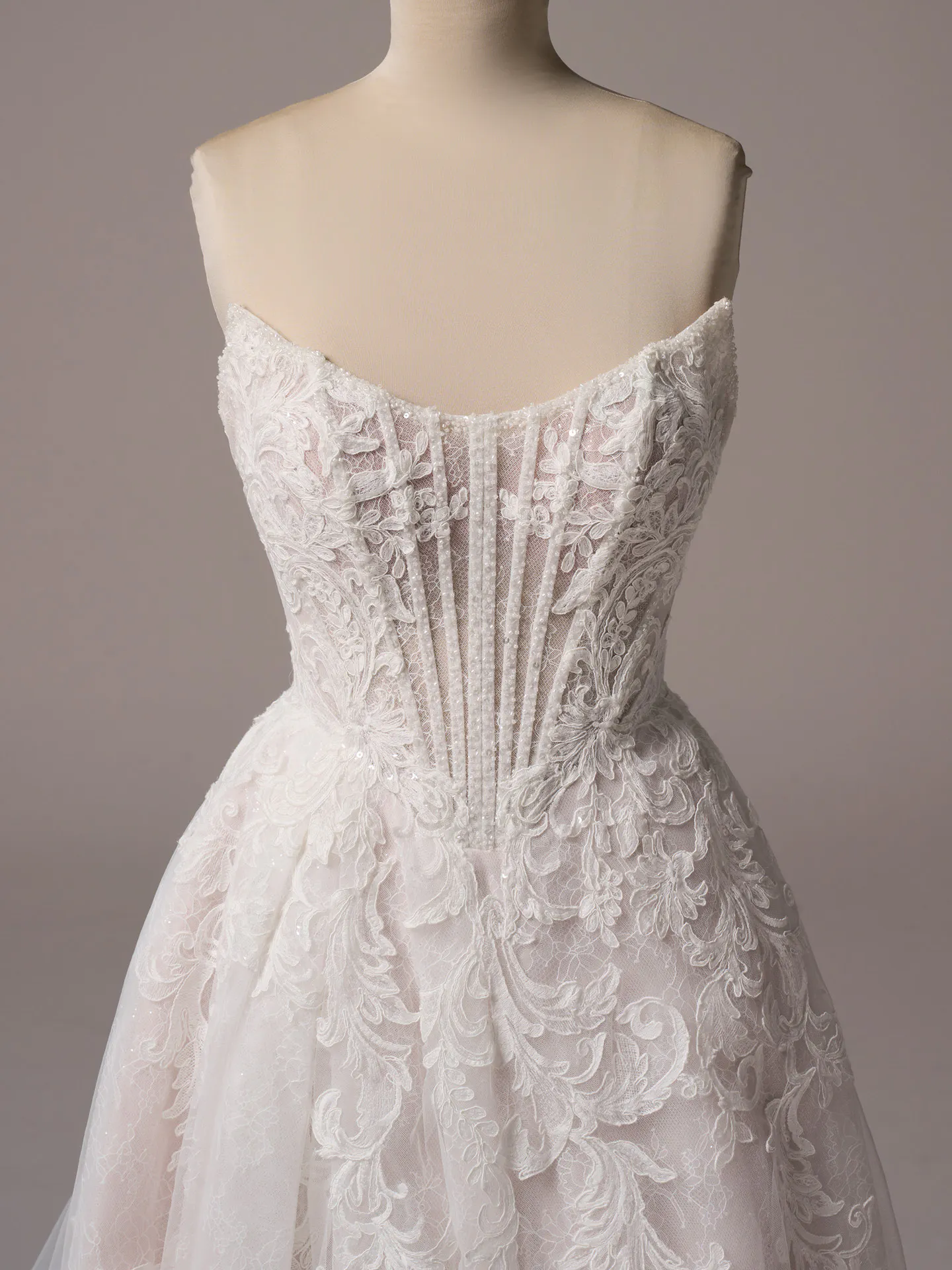 Sottero and Midgley Parker A-line gown front view with exposed boning and lace details