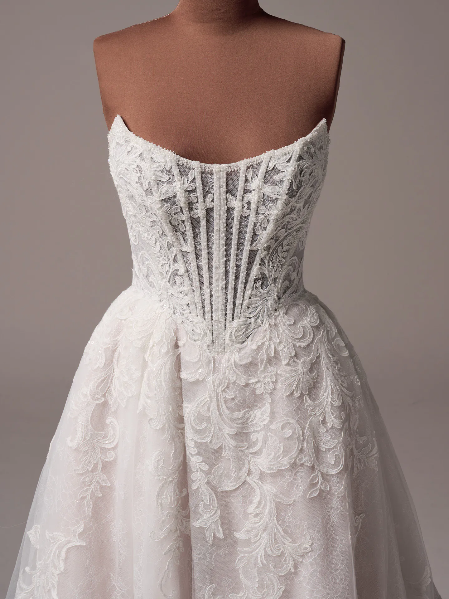 Sottero and Midgley Parker front view, glittering A-line with exposed boning and lace details