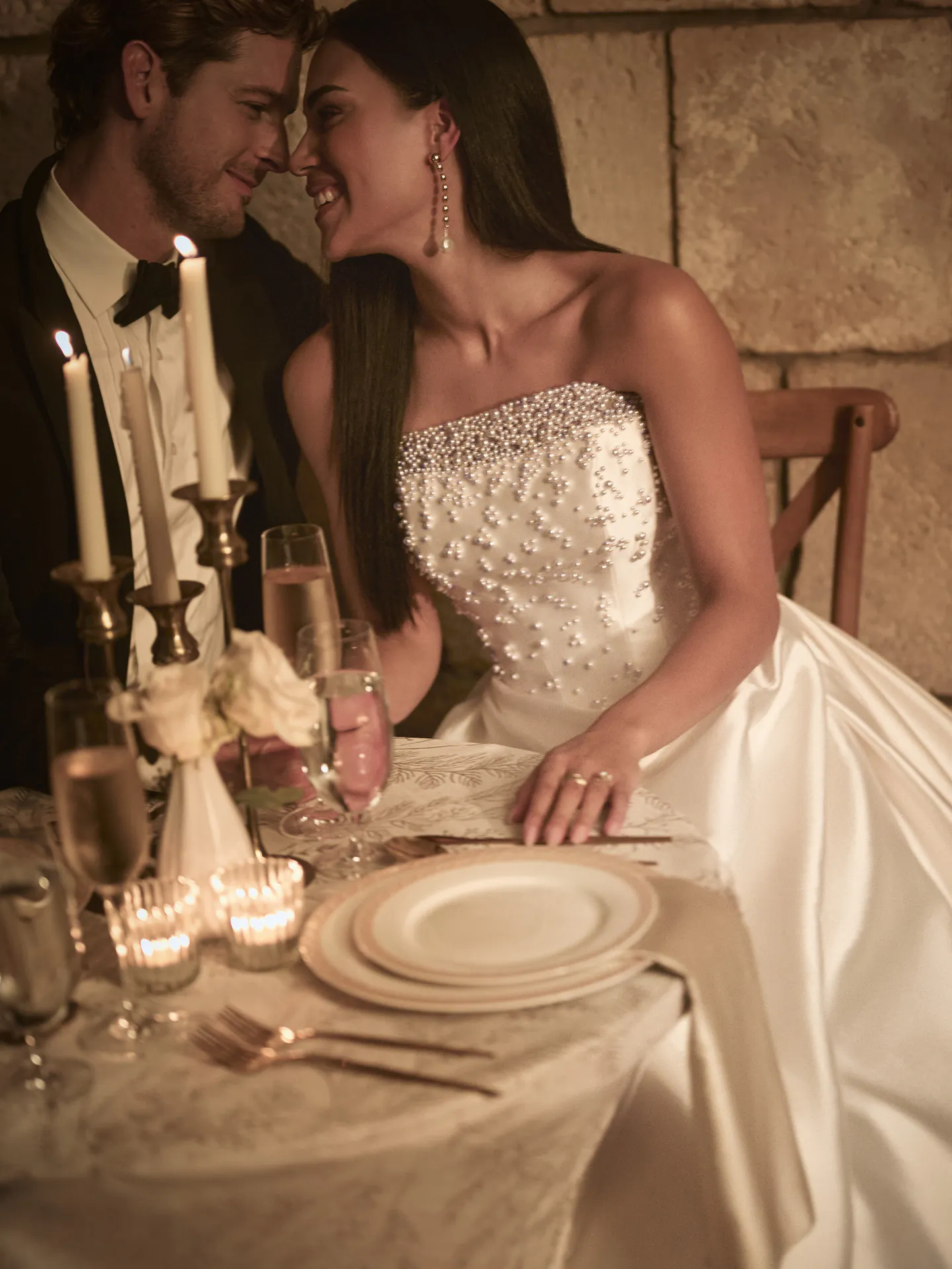 Sottero and Midgley Tenille front view A-line wedding dress at a candlelit dinner table.
