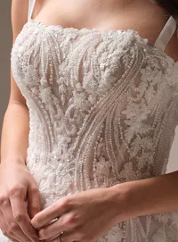 Rebecca Ingram Angie close-up showing beaded lace detail on wedding gown bodice.