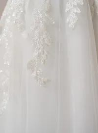 Rebecca Ingram Carmen gown, close-up of lace detail.