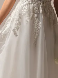 Rebecca Ingram Carmen side view, spaghetti strap A-line with lace leaf details.