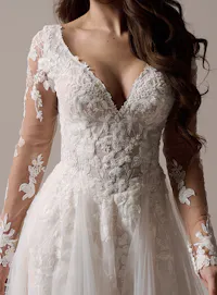Rebecca Ingram Honor front view, beaded V-neck A-line wedding dress with sheer lace sleeves.
