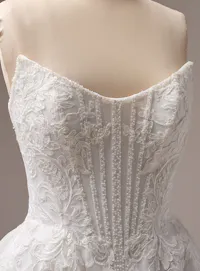 Sottero and Midgley Parker close-up A-line gown with lace and exposed boning.