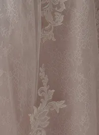 Parker gown lace detail with floral patterns by Sottero and Midgley.