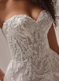 Rebecca Ingram Victoria A-line bridal gown with sparkly slit and floral embellishments.