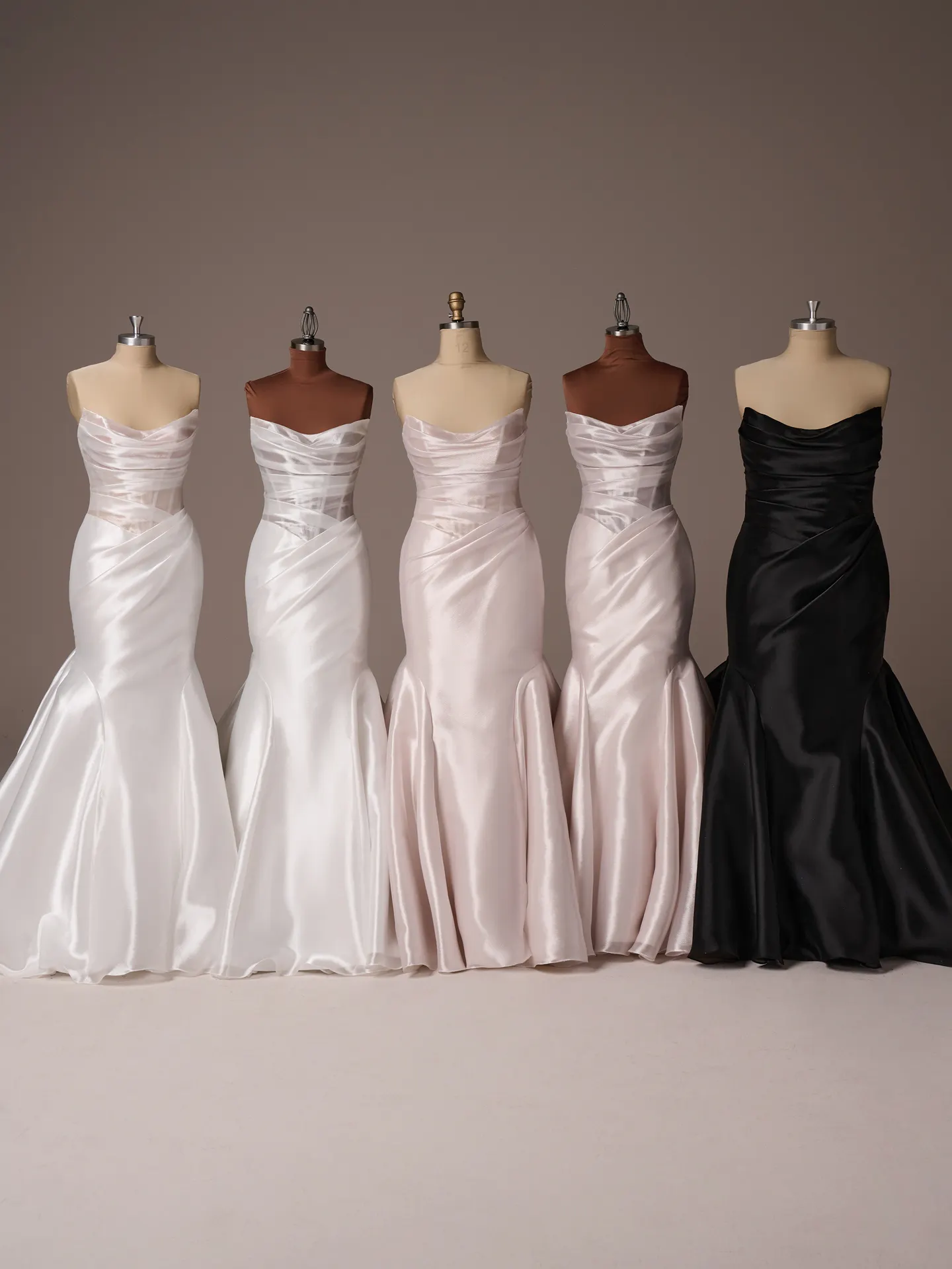 Sottero and Midgley Lagos dresses on mannequins, various shades, back view.