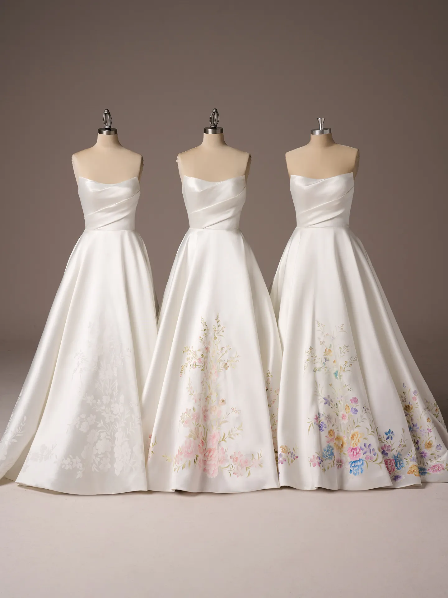 Sottero and Midgley Radiance A-line wedding dresses with hand-painted floral designs.