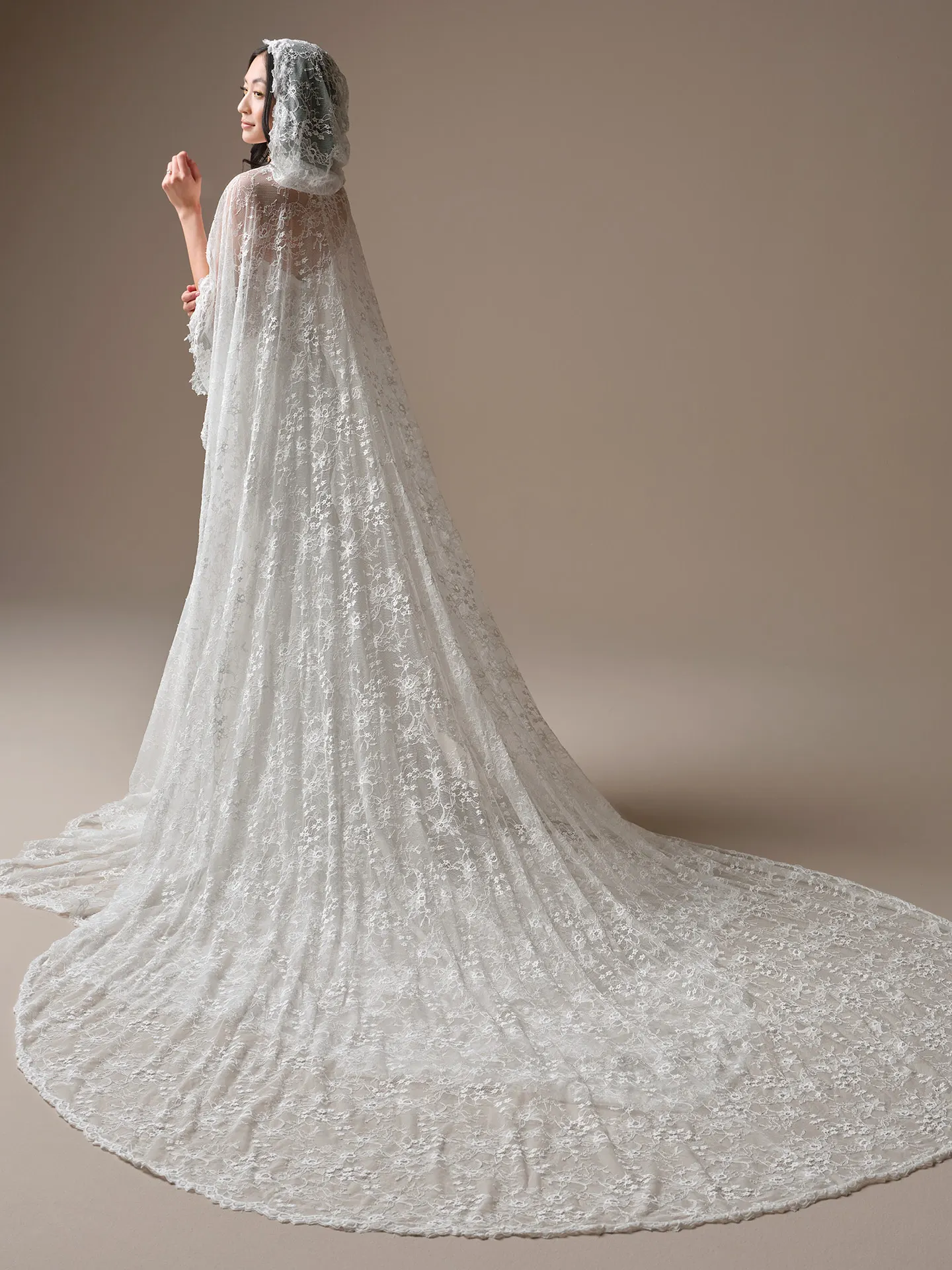 Maggie Sottero Bellevue, back view lace train and hood.