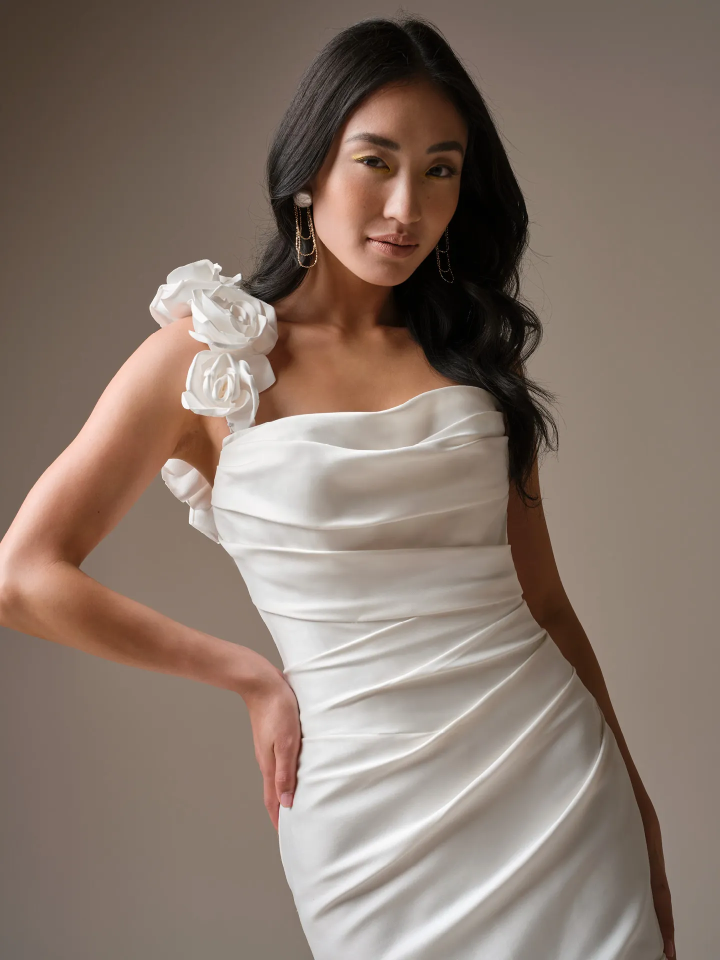 Maggie Sottero Emelina fit-and-flare wedding dress, front view with floral shoulder accents.