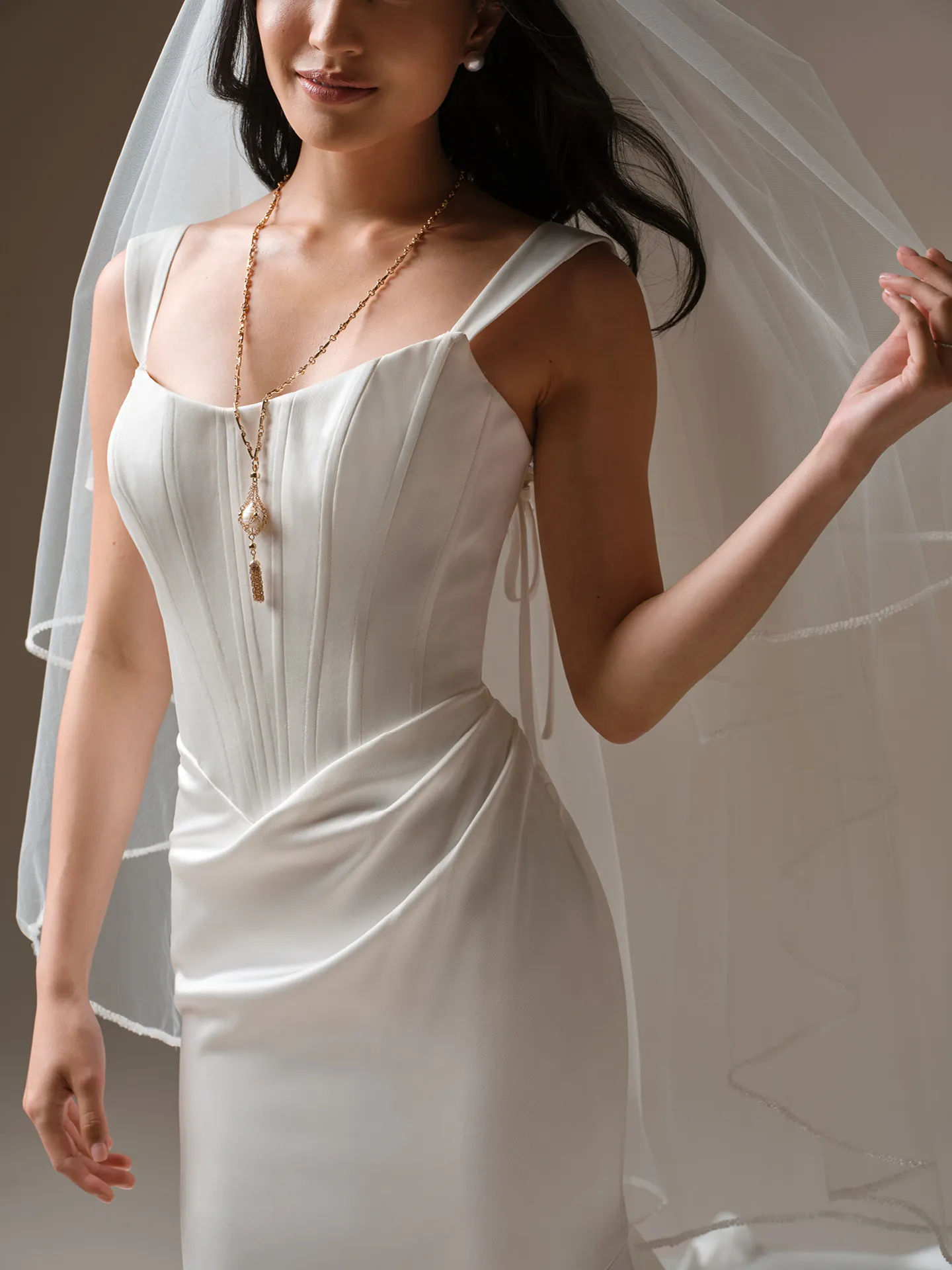Rebecca Ingram sheath dress, front view with sheer bodice and draped skirt detail.