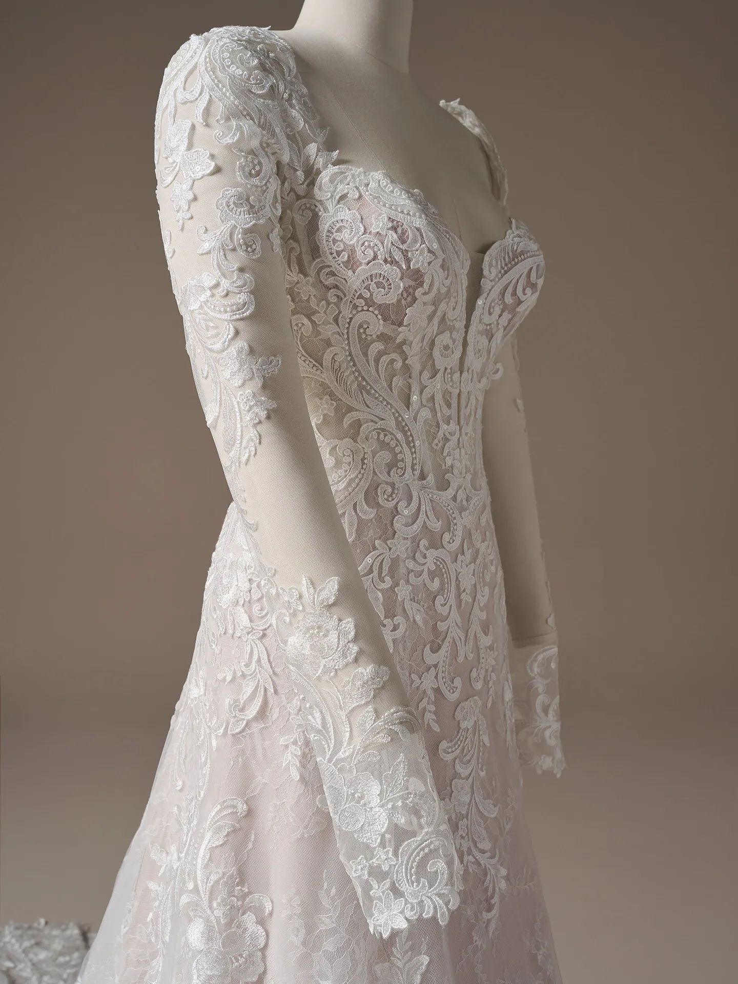 Maggie Sottero Farrah, side view lace A-line dress with plunging neckline.