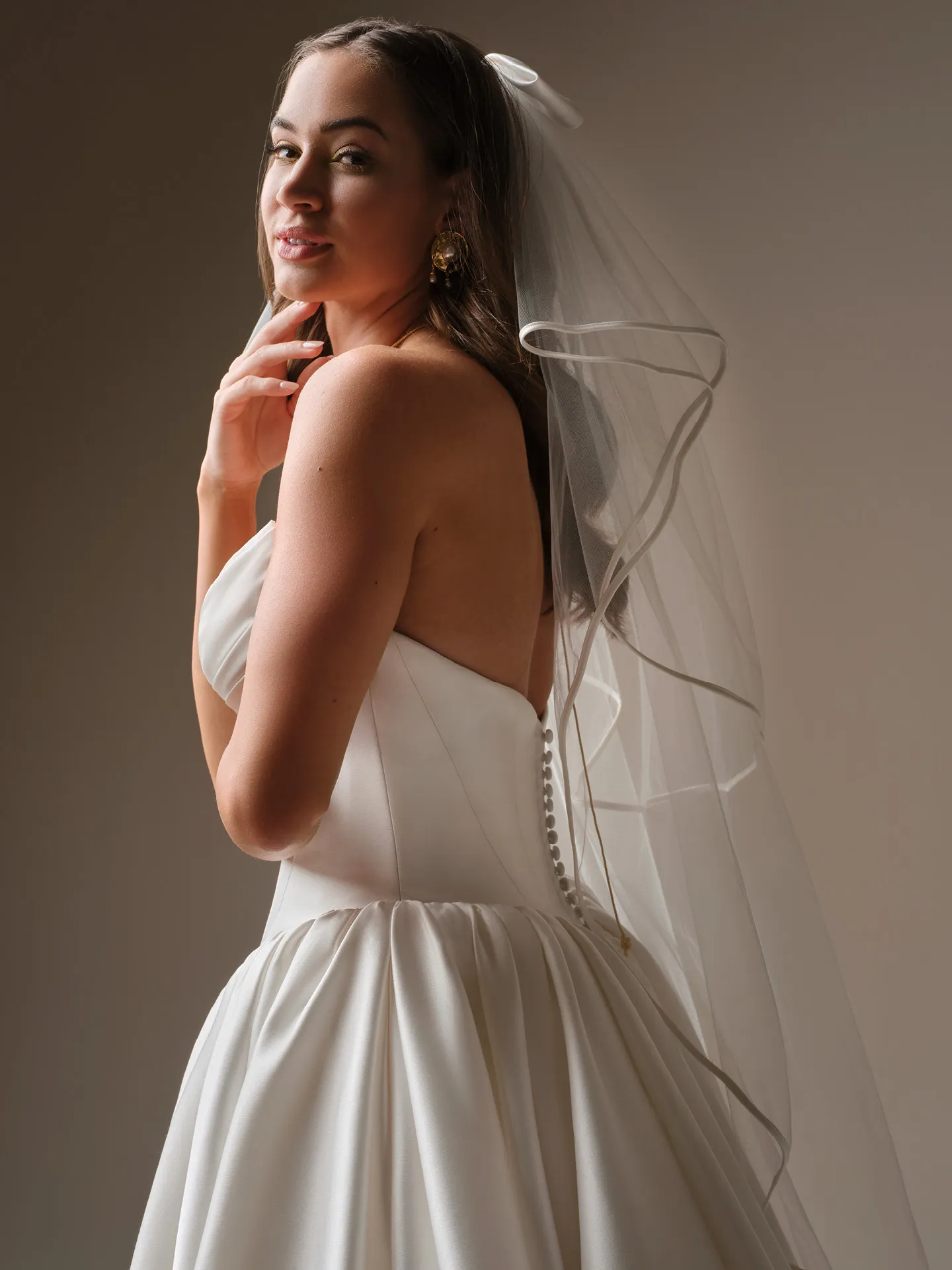 Maggie Sottero Hudson, side view strapless draped bodice ballgown wedding dress.