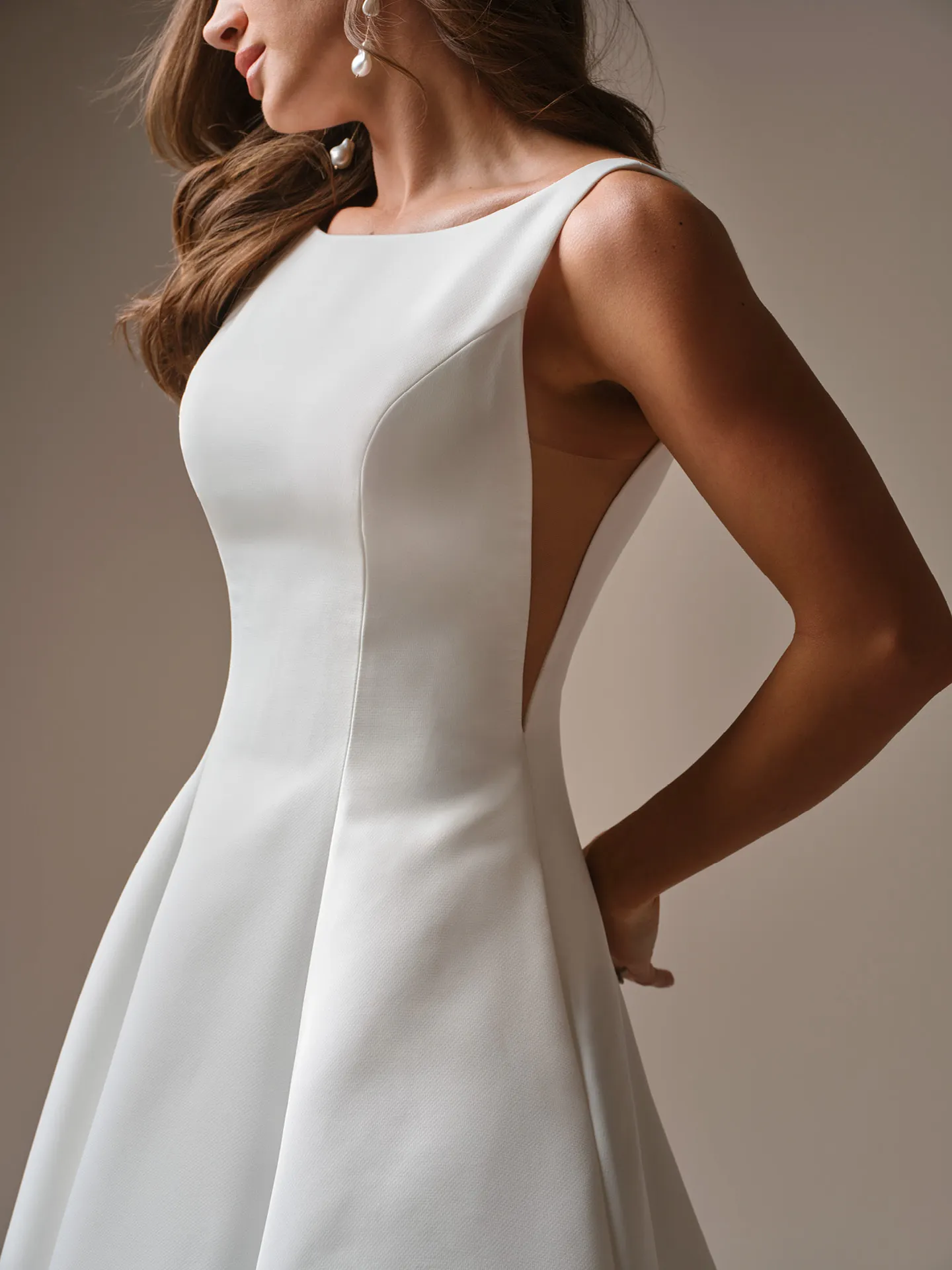 Maggie Sottero Lawrence, side view satin A-line wedding dress.