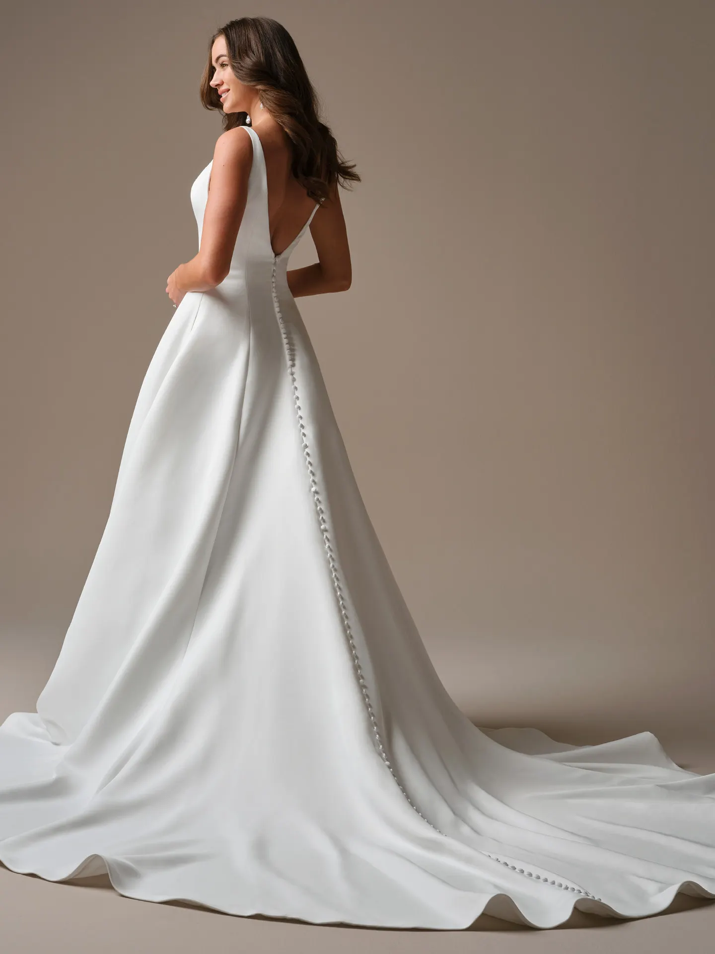 Lawrence, back view satin A-line wedding dress with buttons by Maggie Sottero.