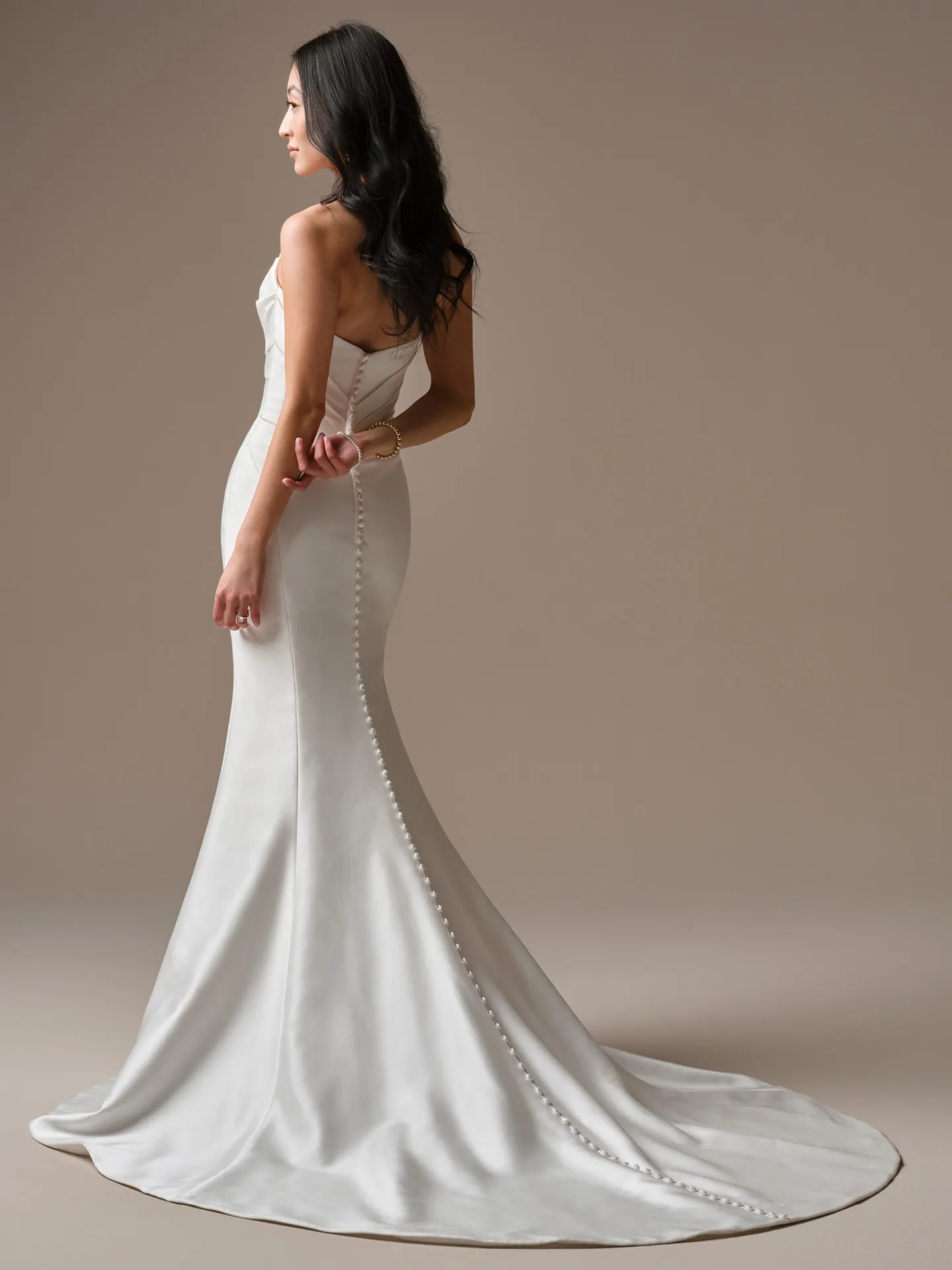 Maureen satin ballgown, back view with button detail.