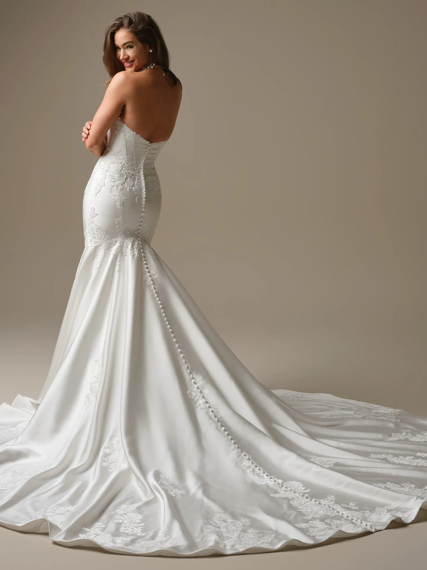 Rebecca Ingram Serafina, back view satin ball gown with button detail.