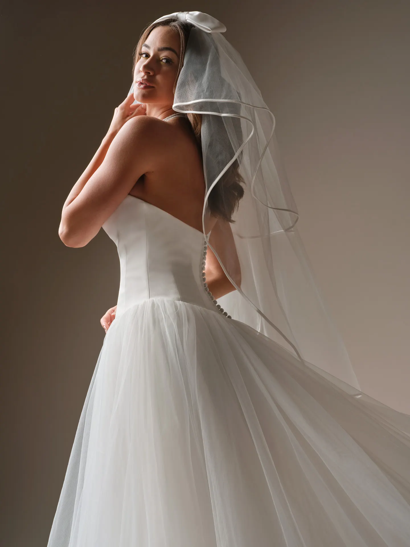 Maggie Sottero Shirley, side view tulle A-line wedding dress and veil.