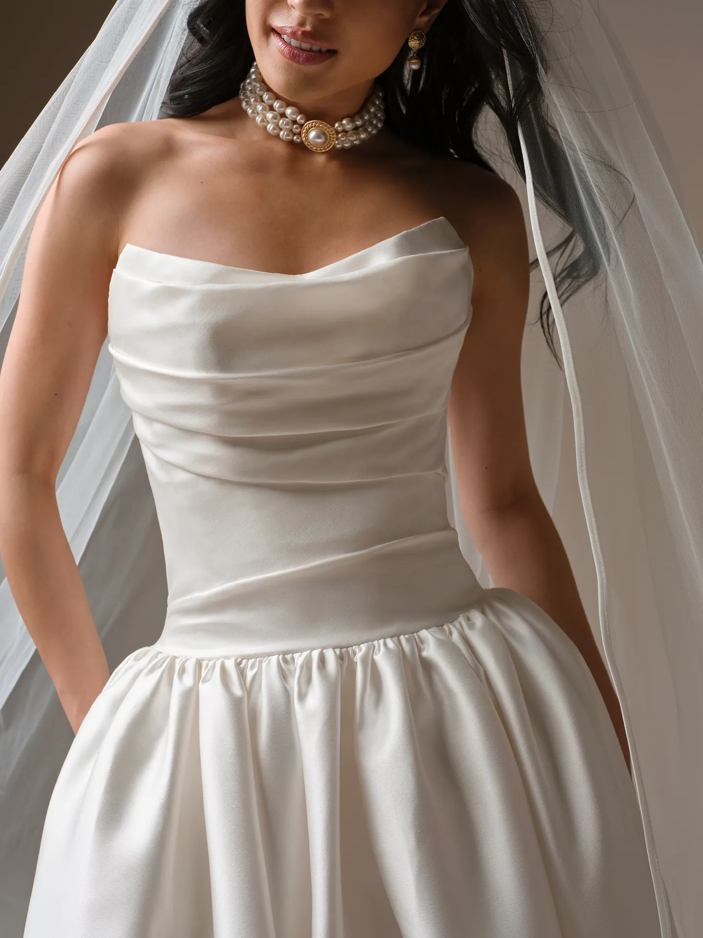 Maggie Sottero Sylvana draped satin A-line dress, front view.