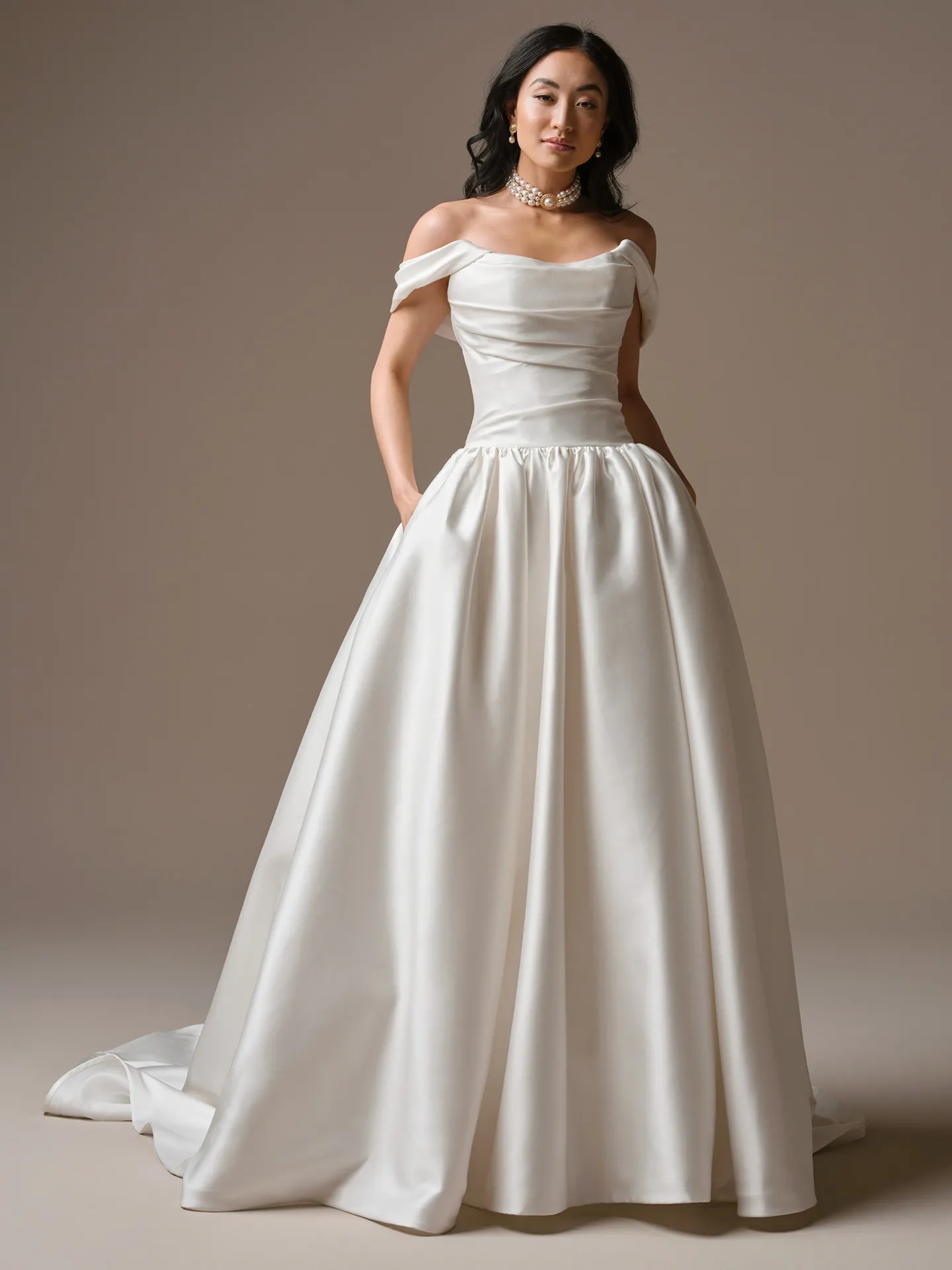 Maggie Sottero Sylvana off-shoulder satin A-line wedding dress front view.