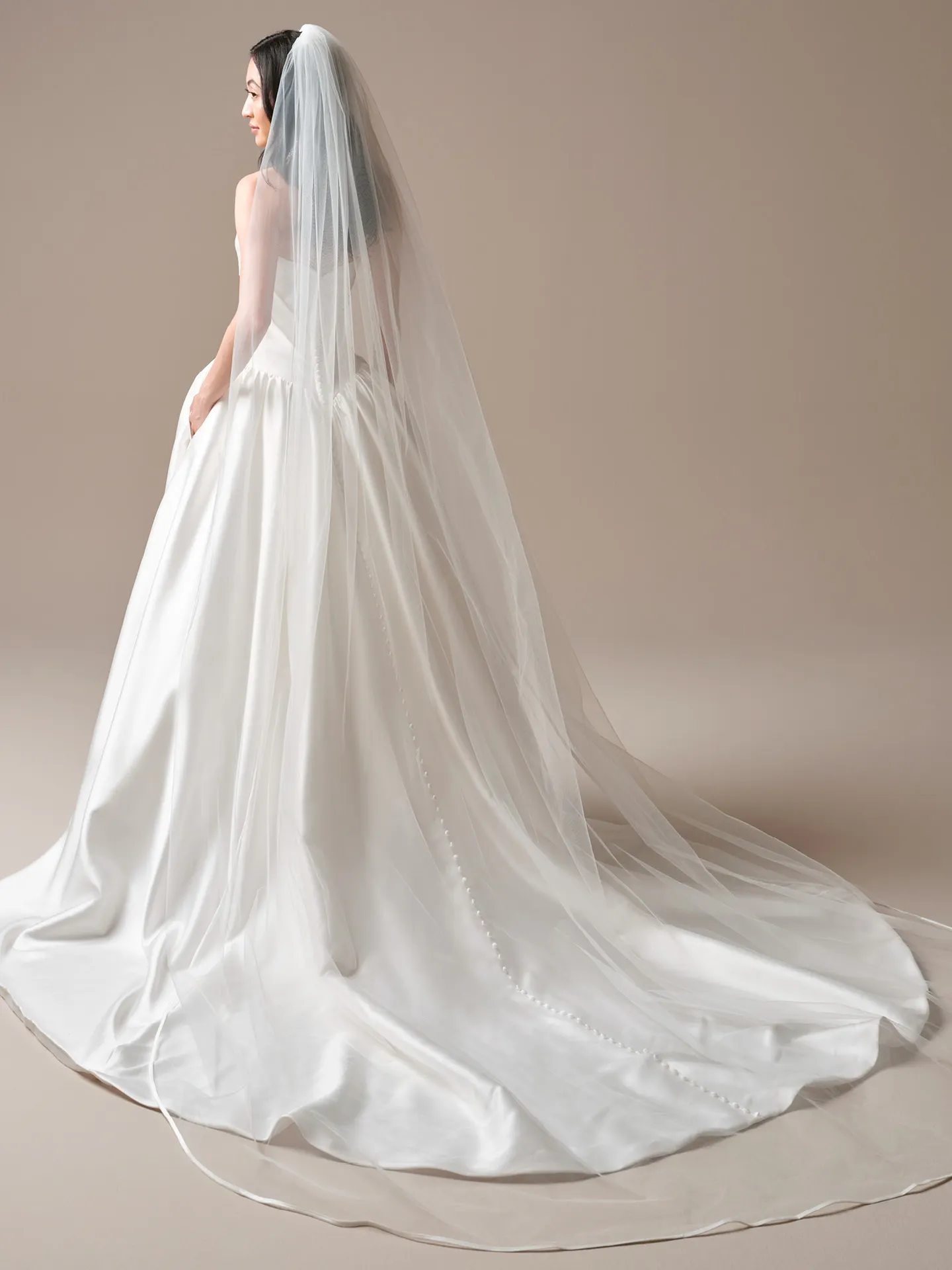 Maggie Sottero Sylvana draped satin A-line dress, back view Maggie Sottero.