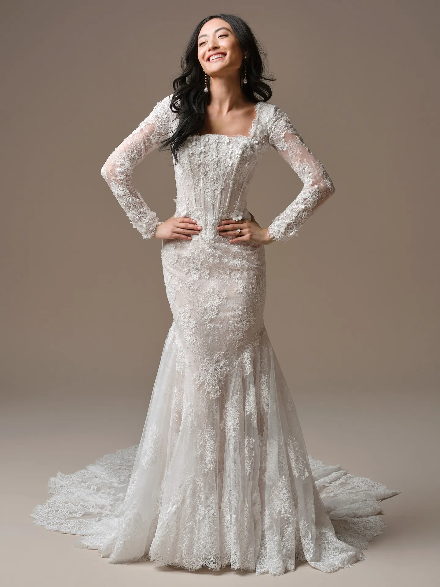 Maggie Sottero Takera mermaid dress, front view with 3-D floral lace and long sleeves.