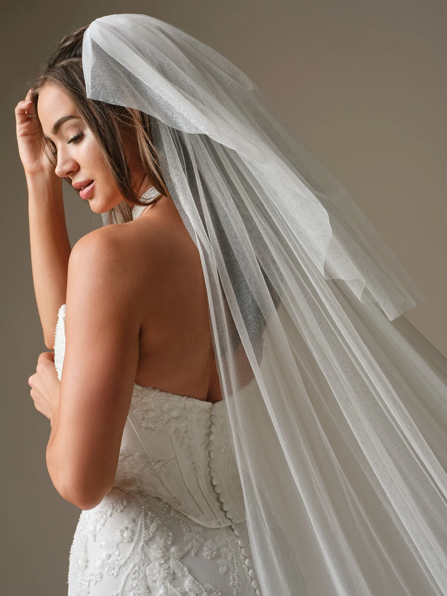Maggie Sottero Wyntelle fit-and-flare, back view with veil Maggie Sottero.