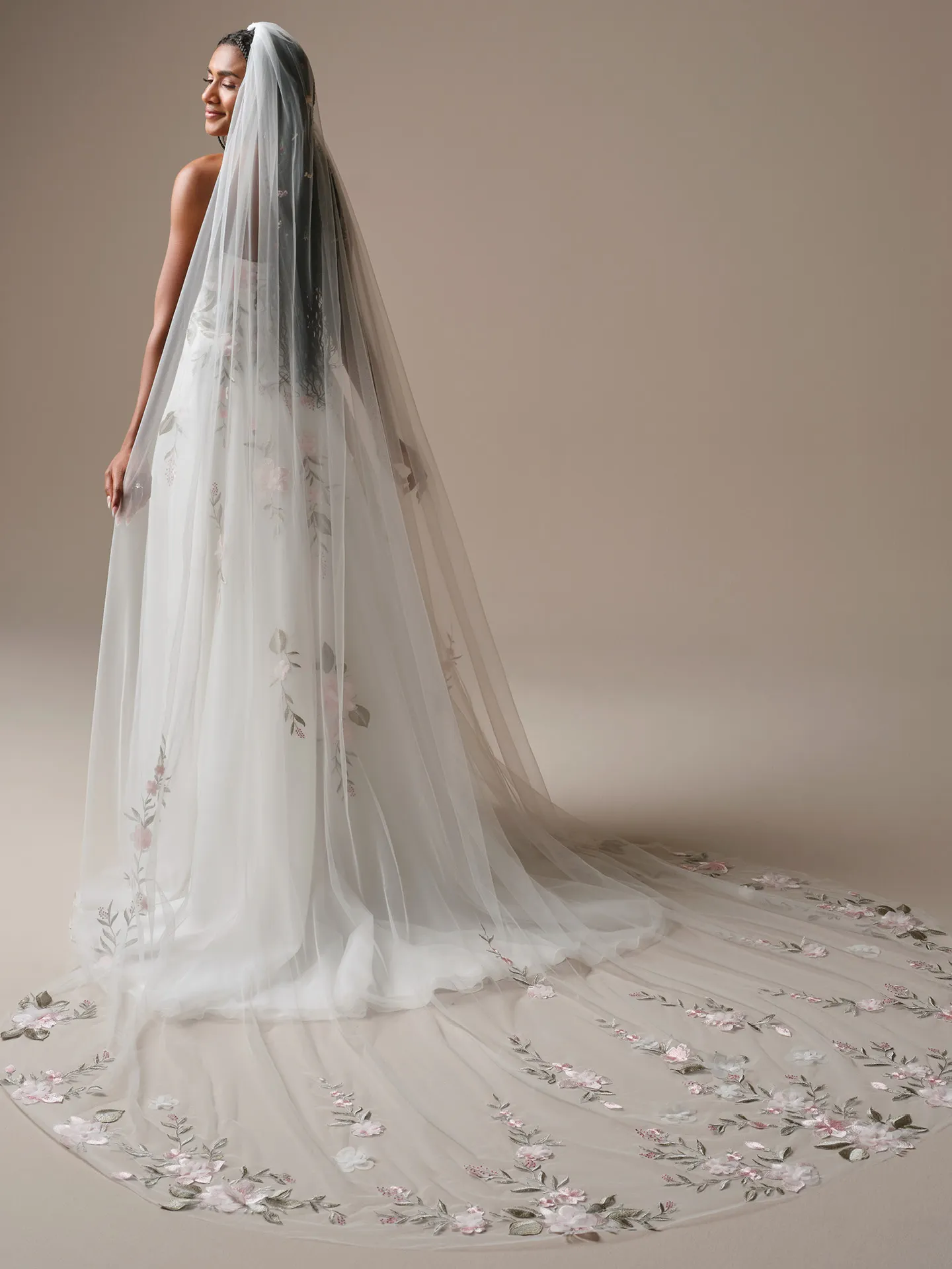 Rebecca Ingram Blossom, back view floral lace A-line wedding dress with long veil.