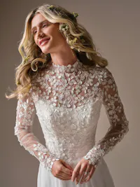 Georgina detachable illusion 3-D lace bridal jacket with basque waist, high neckline, and buttoned sleeves