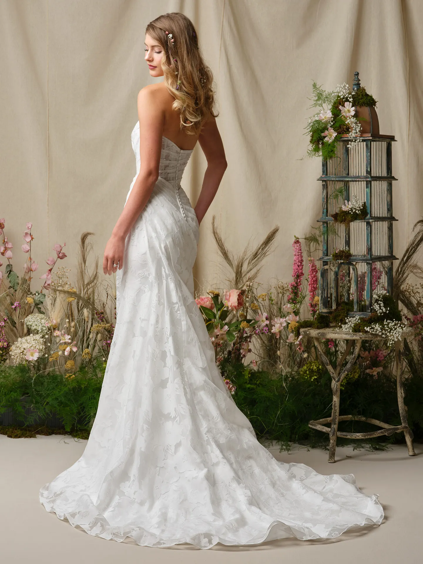 Rebecca Ingram Kendall back view, printed organza sheath dress with floral backdrop