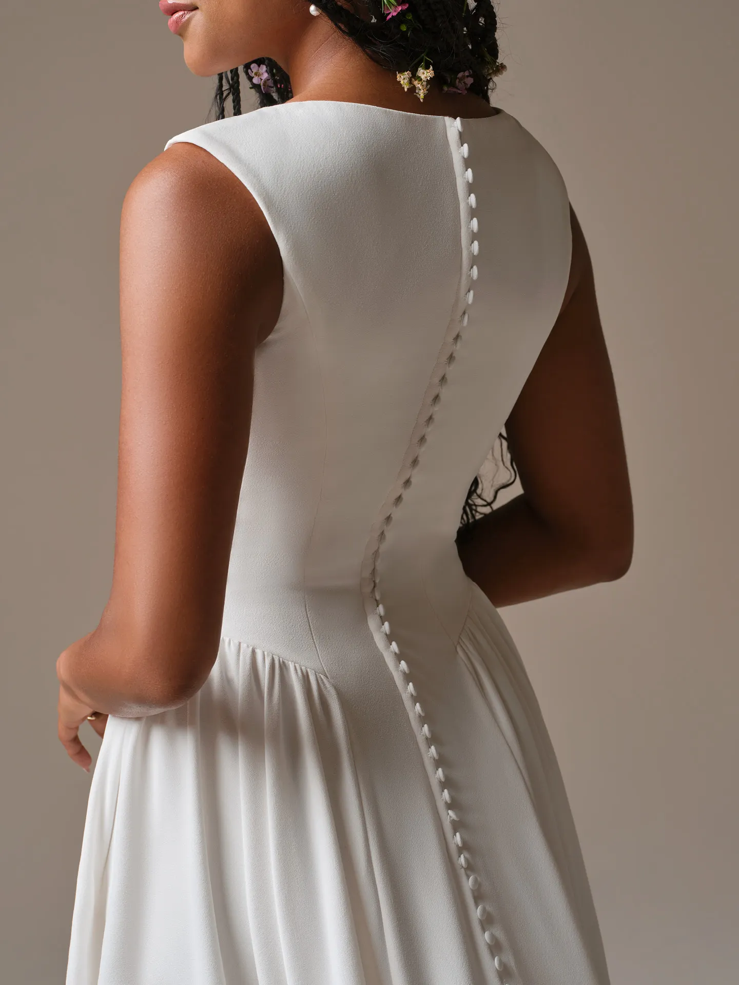 Rebecca Ingram Shay back view showing buttons and cap-sleeve A-line wedding dress