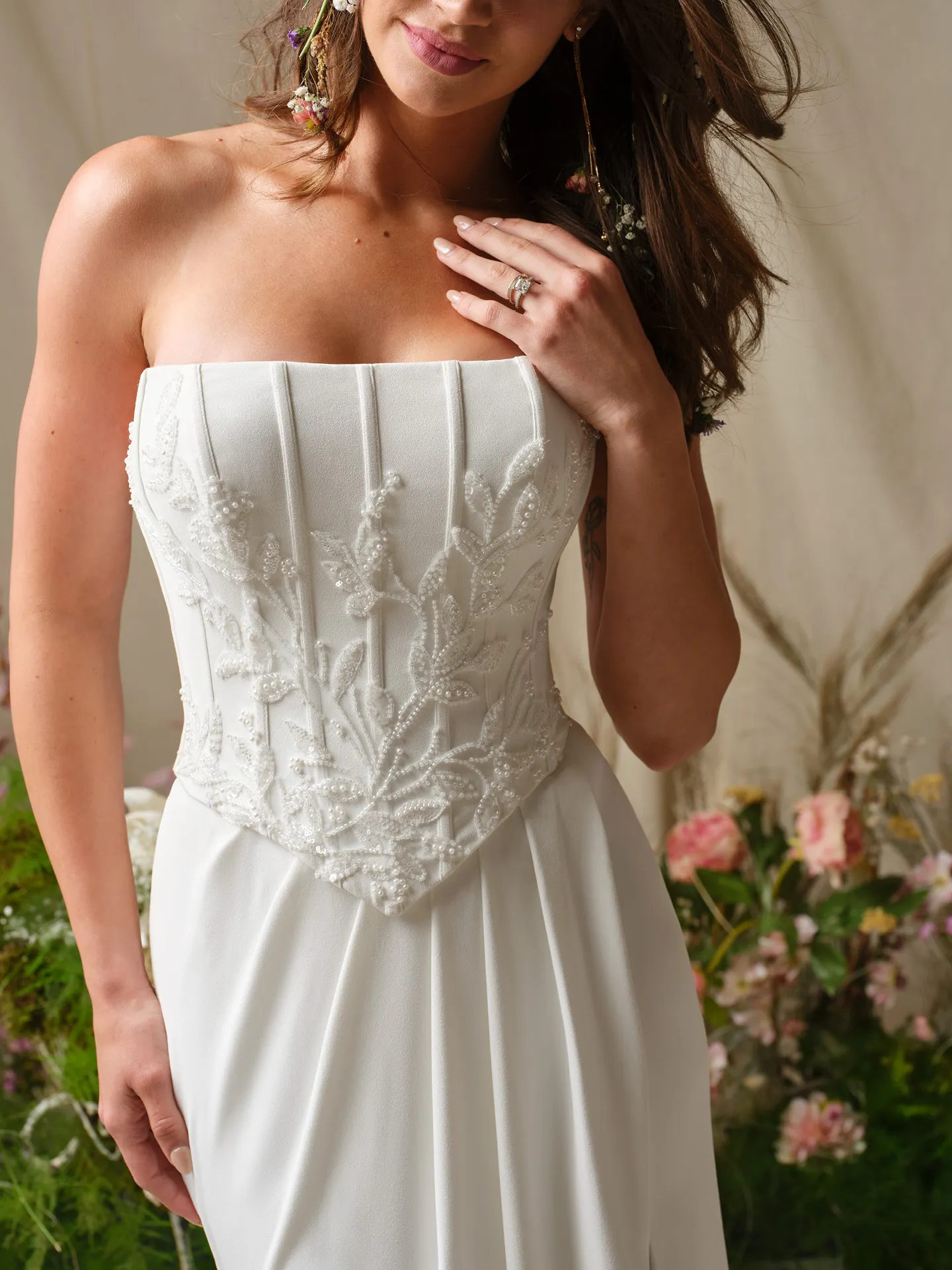 Rebecca Ingram Terry front view beaded sheath dress with flowers in background